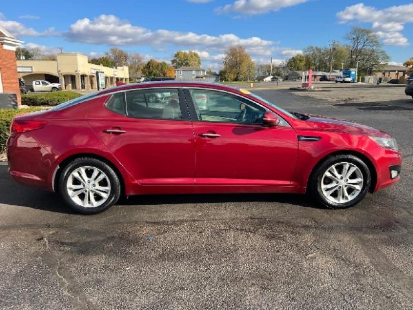 2013 Remington Red Metallic Kia Optima LX AT (5XXGM4A71DG) with an 2.4L L4 DOHC 16V engine, 6-Speed Automatic transmission, located at 1230 East Main St, Xenia, OH, 45385, (937) 908-9800, 39.687321, -83.910294 - Photo#5