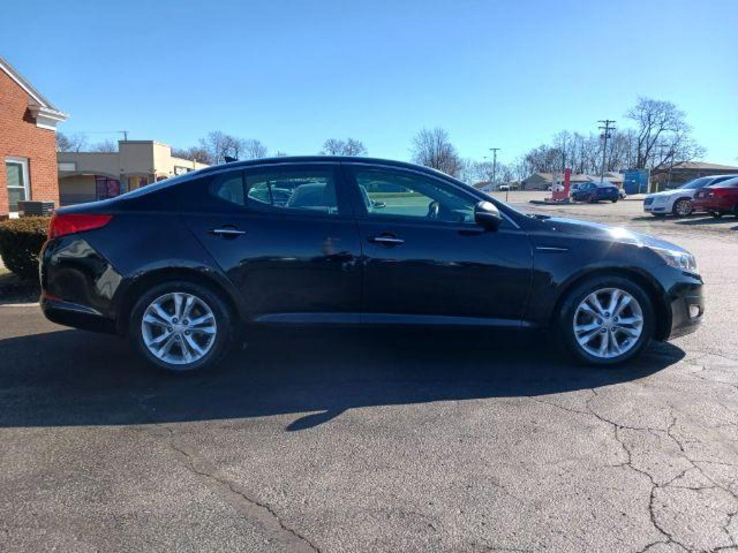 2013 Ebony Black Kia Optima LX AT (5XXGM4A73DG) with an 2.4L L4 DOHC 16V engine, 6-Speed Automatic transmission, located at 1230 East Main St, Xenia, OH, 45385, (937) 908-9800, 39.687321, -83.910294 - Photo#4