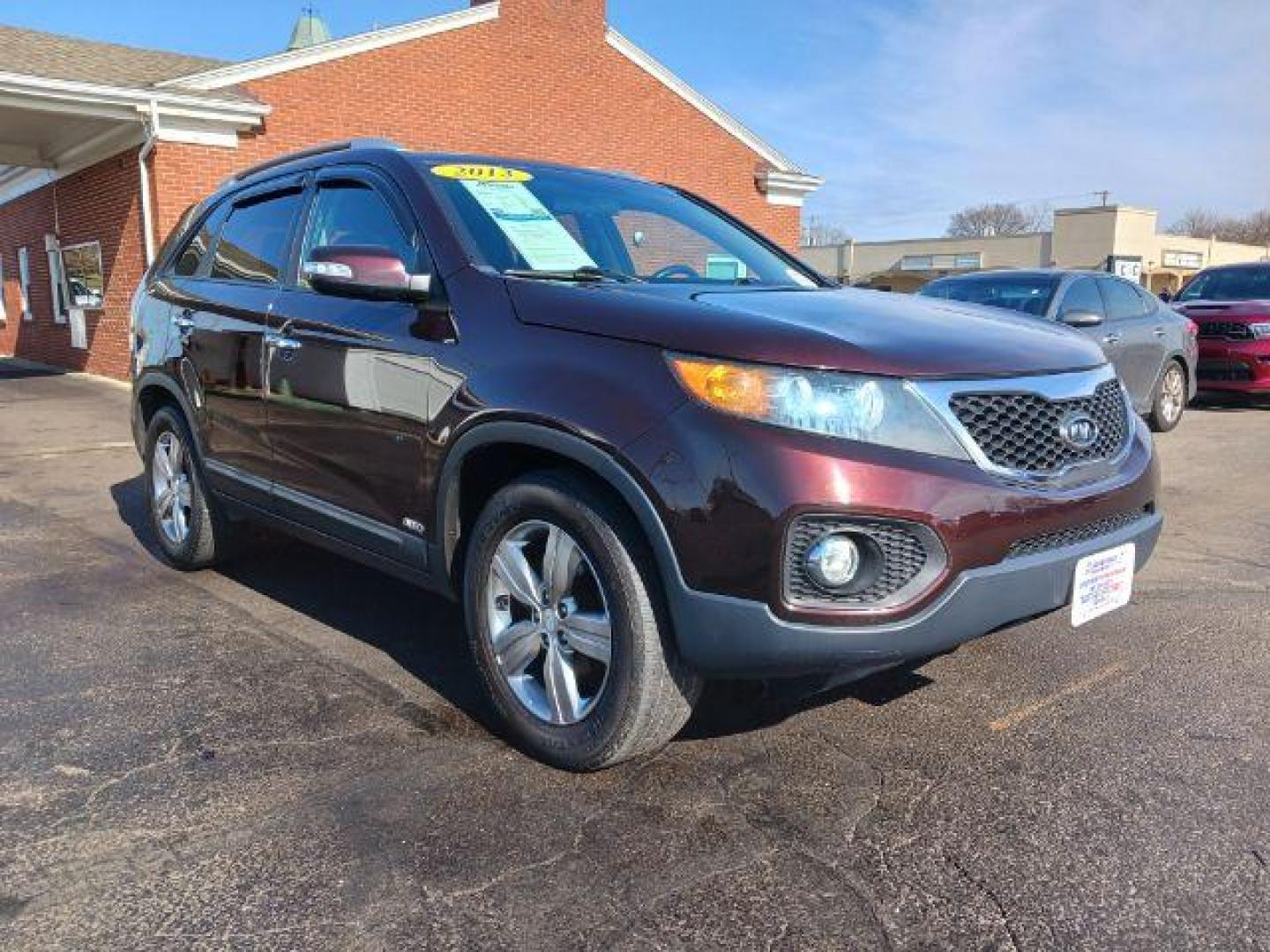 2013 Dark Cherry Kia Sorento EX 4WD (5XYKUCA67DG) with an 2.4L L4 DOHC 16V engine, 6-Speed Automatic transmission, located at 1951 S Dayton Lakeview Rd., New Carlisle, OH, 45344, (937) 908-9800, 39.890999, -84.050255 - Photo#0