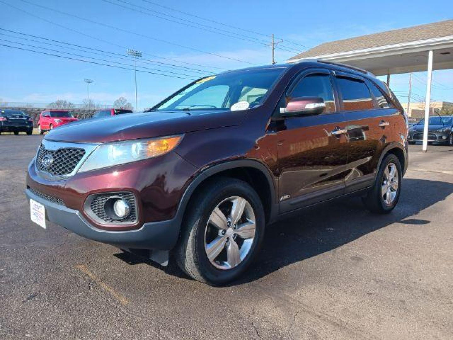 2013 Dark Cherry Kia Sorento EX 4WD (5XYKUCA67DG) with an 2.4L L4 DOHC 16V engine, 6-Speed Automatic transmission, located at 1951 S Dayton Lakeview Rd., New Carlisle, OH, 45344, (937) 908-9800, 39.890999, -84.050255 - Photo#2