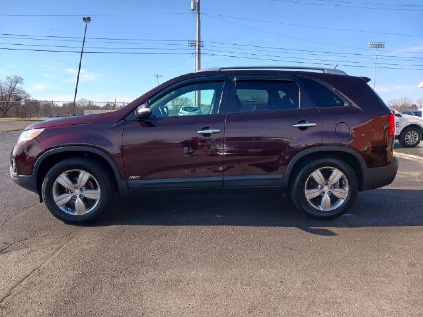 2013 Dark Cherry Kia Sorento EX 4WD (5XYKUCA67DG) with an 2.4L L4 DOHC 16V engine, 6-Speed Automatic transmission, located at 1951 S Dayton Lakeview Rd., New Carlisle, OH, 45344, (937) 908-9800, 39.890999, -84.050255 - Photo#3