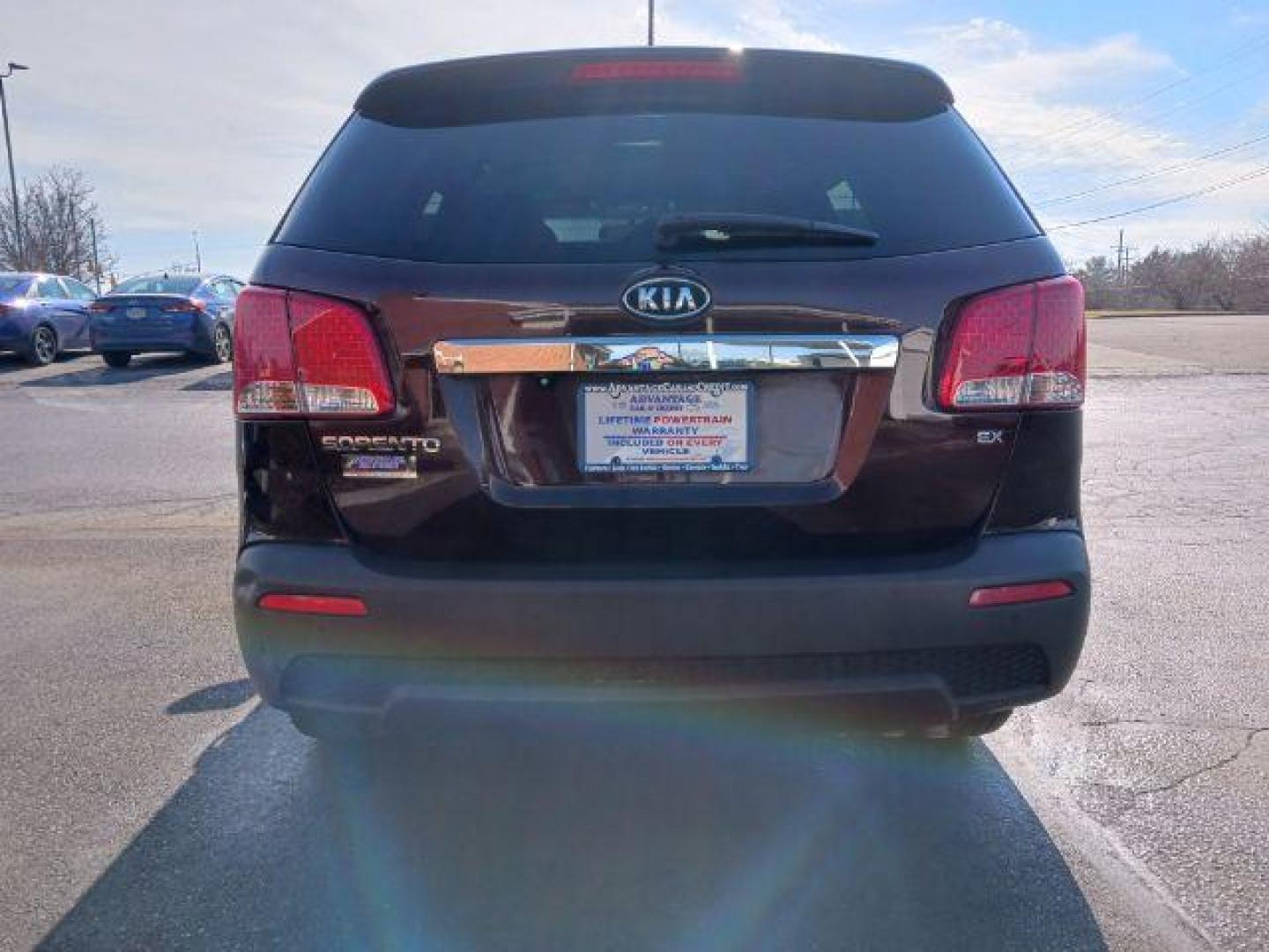 2013 Dark Cherry Kia Sorento EX 4WD (5XYKUCA67DG) with an 2.4L L4 DOHC 16V engine, 6-Speed Automatic transmission, located at 1951 S Dayton Lakeview Rd., New Carlisle, OH, 45344, (937) 908-9800, 39.890999, -84.050255 - Photo#5