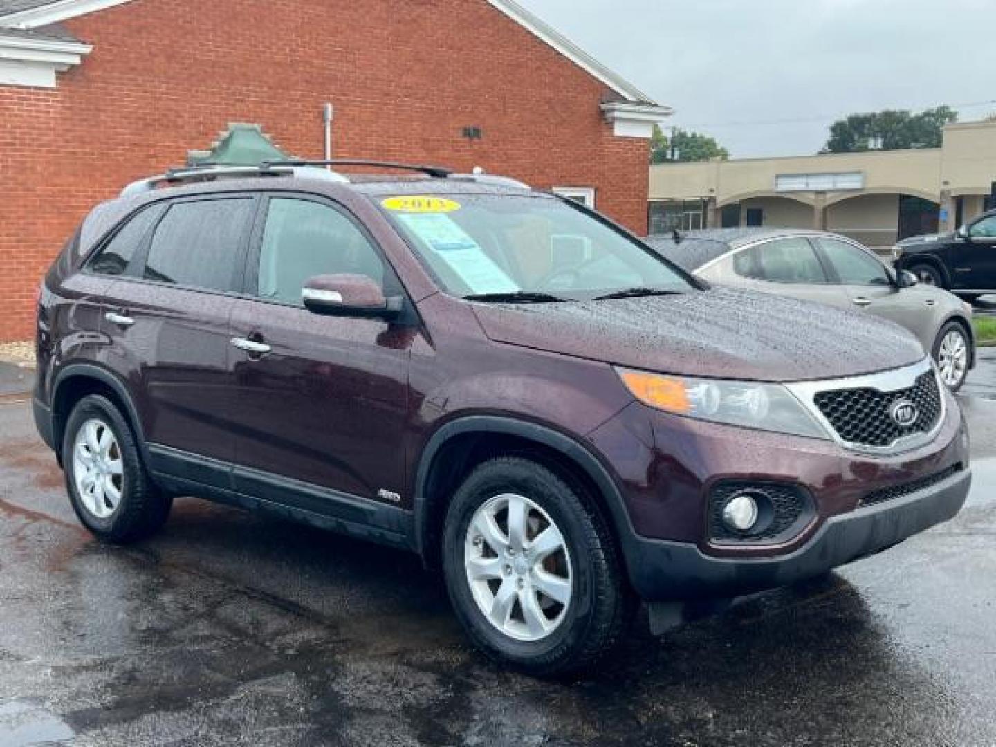 2013 Dark Cherry Kia Sorento LX 4WD (5XYKTDA67DG) with an 2.4L L4 DOHC 16V engine, 6-Speed Automatic transmission, located at 401 Woodman Dr, Riverside, OH, 45431, (937) 908-9800, 39.763779, -84.122063 - Photo#0