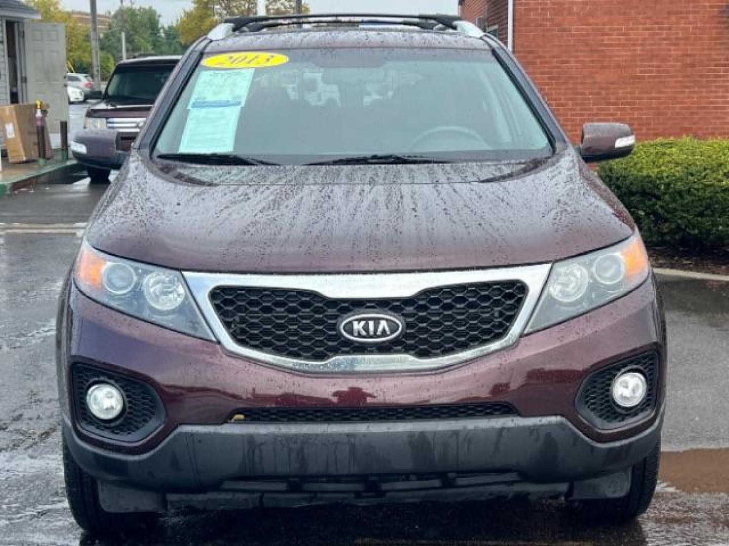 2013 Dark Cherry Kia Sorento LX 4WD (5XYKTDA67DG) with an 2.4L L4 DOHC 16V engine, 6-Speed Automatic transmission, located at 401 Woodman Dr, Riverside, OH, 45431, (937) 908-9800, 39.763779, -84.122063 - Photo#1