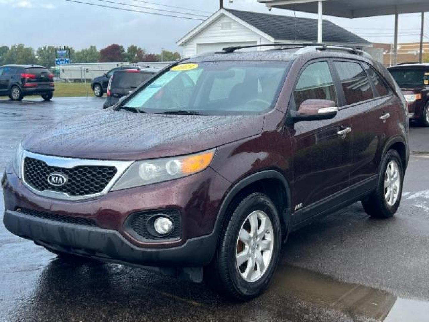 2013 Dark Cherry Kia Sorento LX 4WD (5XYKTDA67DG) with an 2.4L L4 DOHC 16V engine, 6-Speed Automatic transmission, located at 401 Woodman Dr, Riverside, OH, 45431, (937) 908-9800, 39.763779, -84.122063 - Photo#2