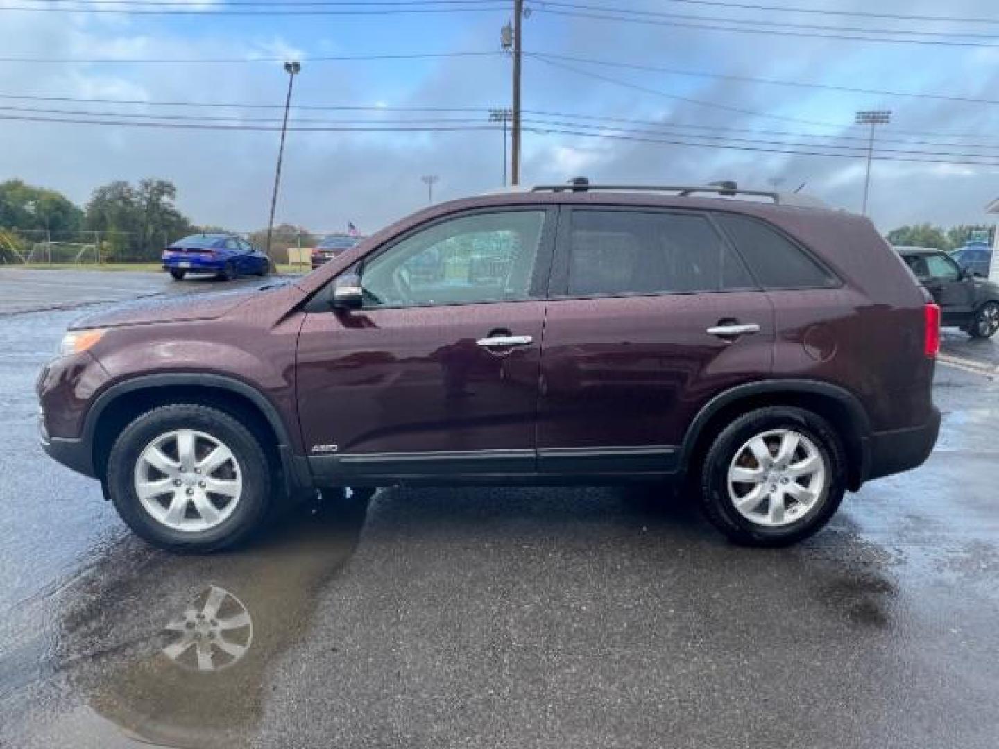 2013 Dark Cherry Kia Sorento LX 4WD (5XYKTDA67DG) with an 2.4L L4 DOHC 16V engine, 6-Speed Automatic transmission, located at 401 Woodman Dr, Riverside, OH, 45431, (937) 908-9800, 39.763779, -84.122063 - Photo#3