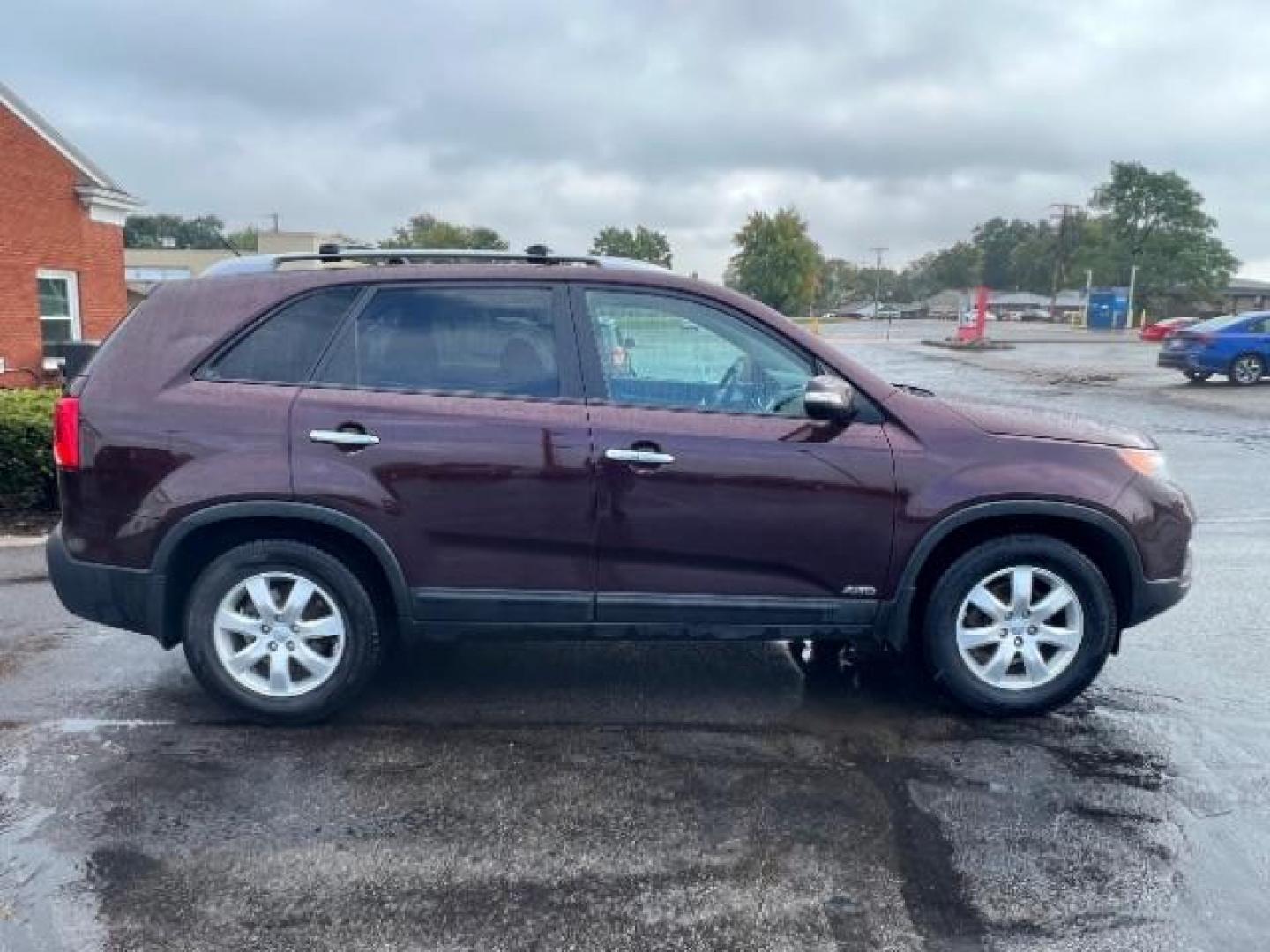 2013 Dark Cherry Kia Sorento LX 4WD (5XYKTDA67DG) with an 2.4L L4 DOHC 16V engine, 6-Speed Automatic transmission, located at 401 Woodman Dr, Riverside, OH, 45431, (937) 908-9800, 39.763779, -84.122063 - Photo#5