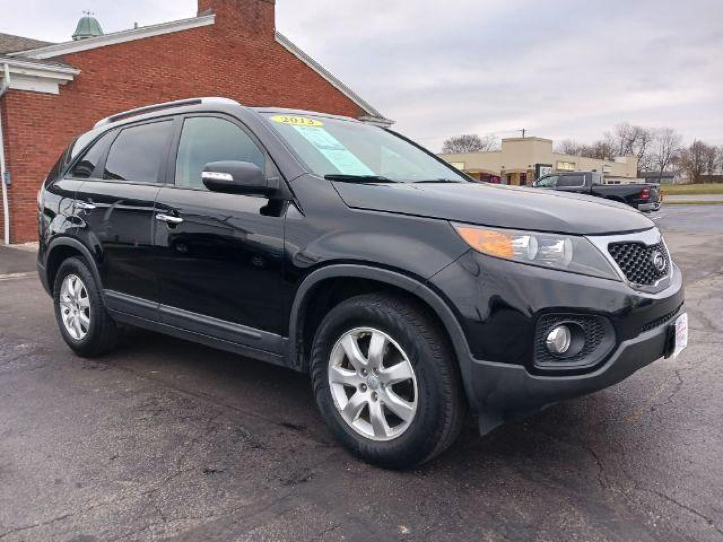 2013 Ebony Black Kia Sorento LX 2WD (5XYKT3A68DG) with an 2.4L L4 DOHC 16V engine, 6-Speed Automatic transmission, located at 401 Woodman Dr, Riverside, OH, 45431, (937) 908-9800, 39.763779, -84.122063 - Photo#0