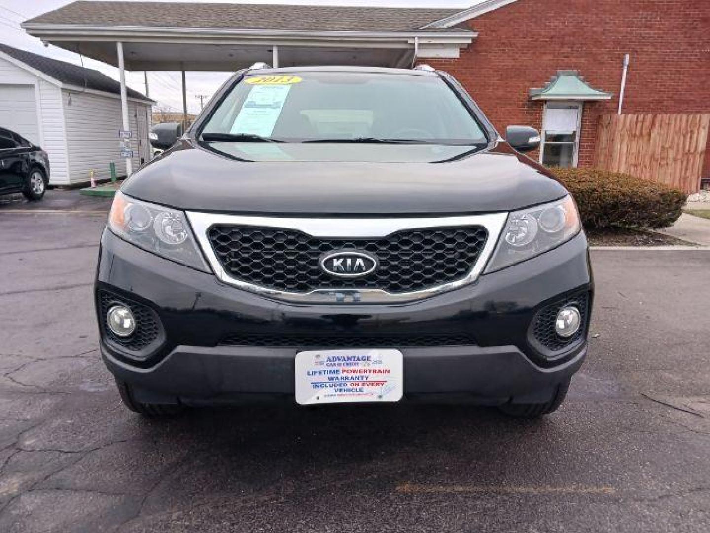 2013 Ebony Black Kia Sorento LX 2WD (5XYKT3A68DG) with an 2.4L L4 DOHC 16V engine, 6-Speed Automatic transmission, located at 401 Woodman Dr, Riverside, OH, 45431, (937) 908-9800, 39.763779, -84.122063 - Photo#1