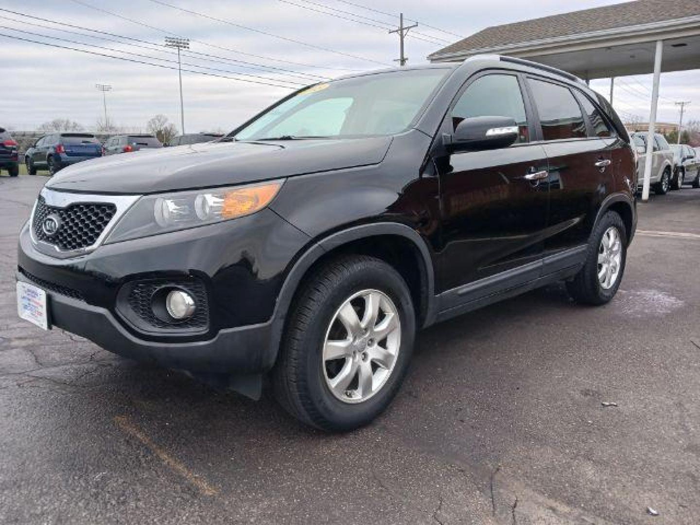 2013 Ebony Black Kia Sorento LX 2WD (5XYKT3A68DG) with an 2.4L L4 DOHC 16V engine, 6-Speed Automatic transmission, located at 401 Woodman Dr, Riverside, OH, 45431, (937) 908-9800, 39.763779, -84.122063 - Photo#2