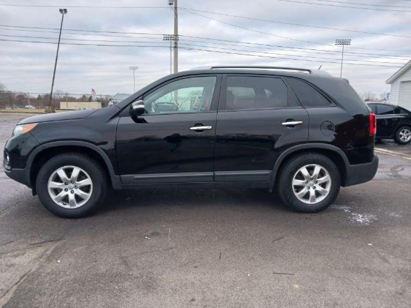 2013 Ebony Black Kia Sorento LX 2WD (5XYKT3A68DG) with an 2.4L L4 DOHC 16V engine, 6-Speed Automatic transmission, located at 401 Woodman Dr, Riverside, OH, 45431, (937) 908-9800, 39.763779, -84.122063 - Photo#3