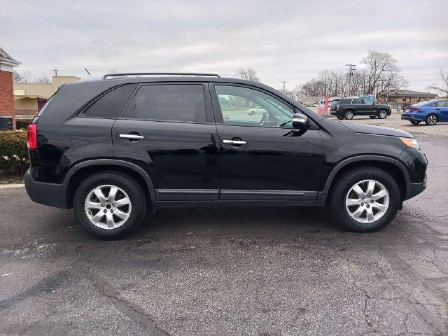 2013 Ebony Black Kia Sorento LX 2WD (5XYKT3A68DG) with an 2.4L L4 DOHC 16V engine, 6-Speed Automatic transmission, located at 401 Woodman Dr, Riverside, OH, 45431, (937) 908-9800, 39.763779, -84.122063 - Photo#4