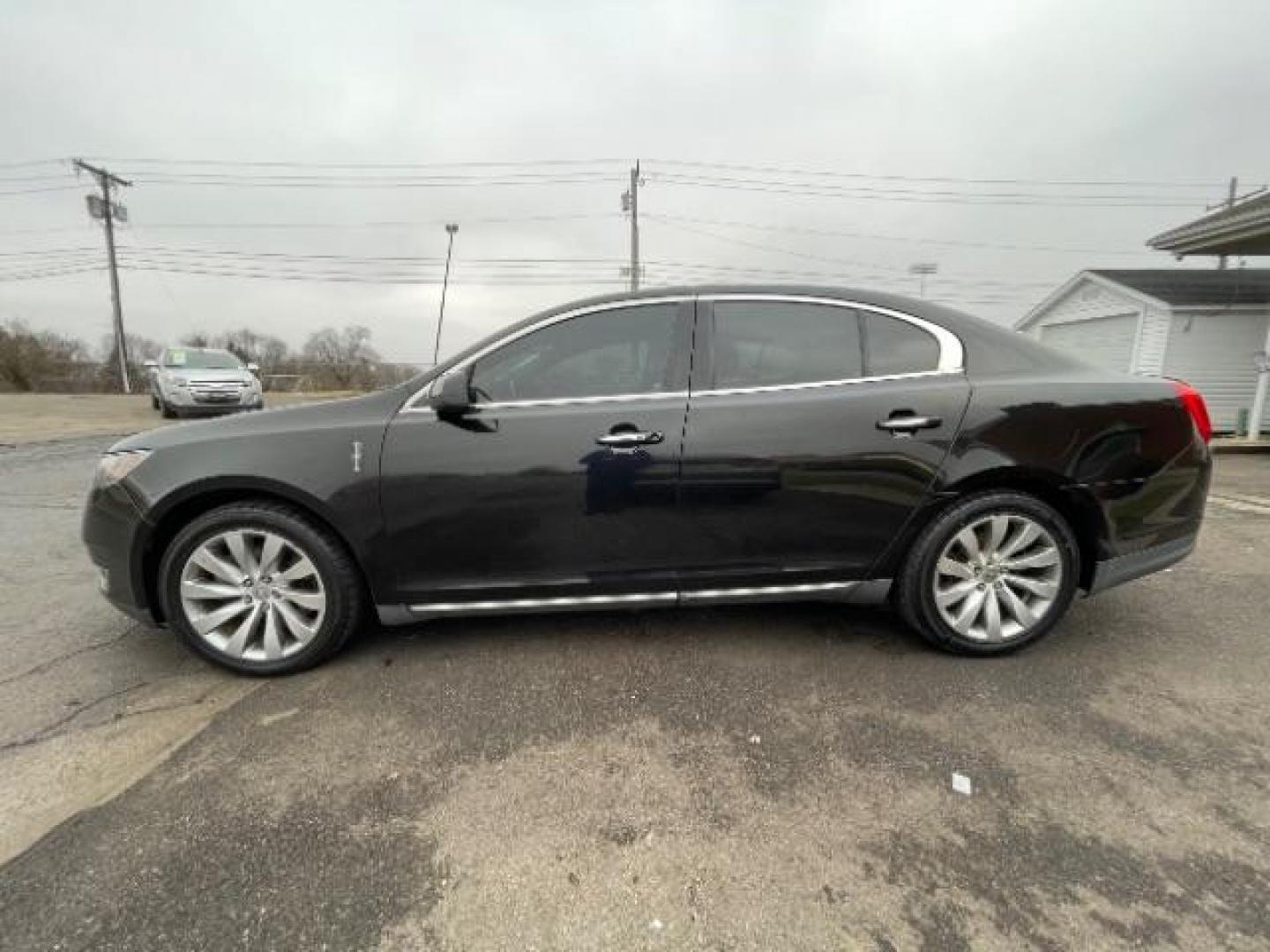 2013 Tuxedo Black Lincoln MKS FWD (1LNHL9DK0DG) with an 3.5L V6 DOHC 24V engine, 6-Speed Automatic transmission, located at 1230 East Main St, Xenia, OH, 45385, (937) 908-9800, 39.687321, -83.910294 - Photo#2