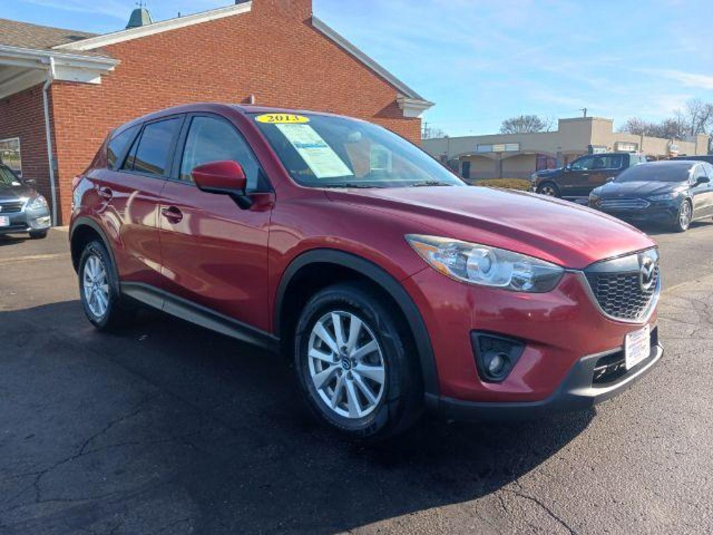 2013 Red Mazda CX-5 Touring AWD (JM3KE4CE4D0) with an 2.0L L4 DOHC 16V engine, 6-Speed Automatic transmission, located at 401 Woodman Dr, Riverside, OH, 45431, (937) 908-9800, 39.763779, -84.122063 - Photo#0