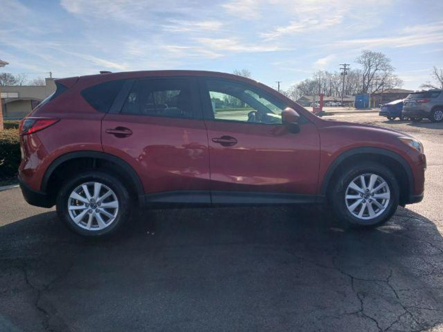 2013 Red Mazda CX-5 Touring AWD (JM3KE4CE4D0) with an 2.0L L4 DOHC 16V engine, 6-Speed Automatic transmission, located at 401 Woodman Dr, Riverside, OH, 45431, (937) 908-9800, 39.763779, -84.122063 - Photo#4