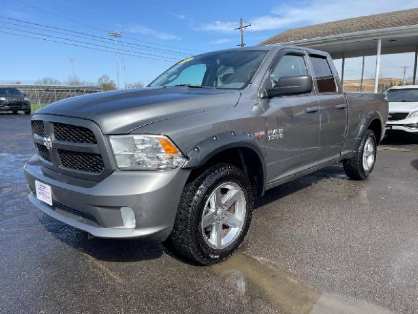 2013 Mineral Gray Metallic RAM 1500 Tradesman Quad Cab 4WD (1C6RR7FT8DS) with an 5.7L V8 OHV 16V engine, 6-Speed Automatic transmission, located at 1230 East Main St, Xenia, OH, 45385, (937) 908-9800, 39.687321, -83.910294 - Photo#1