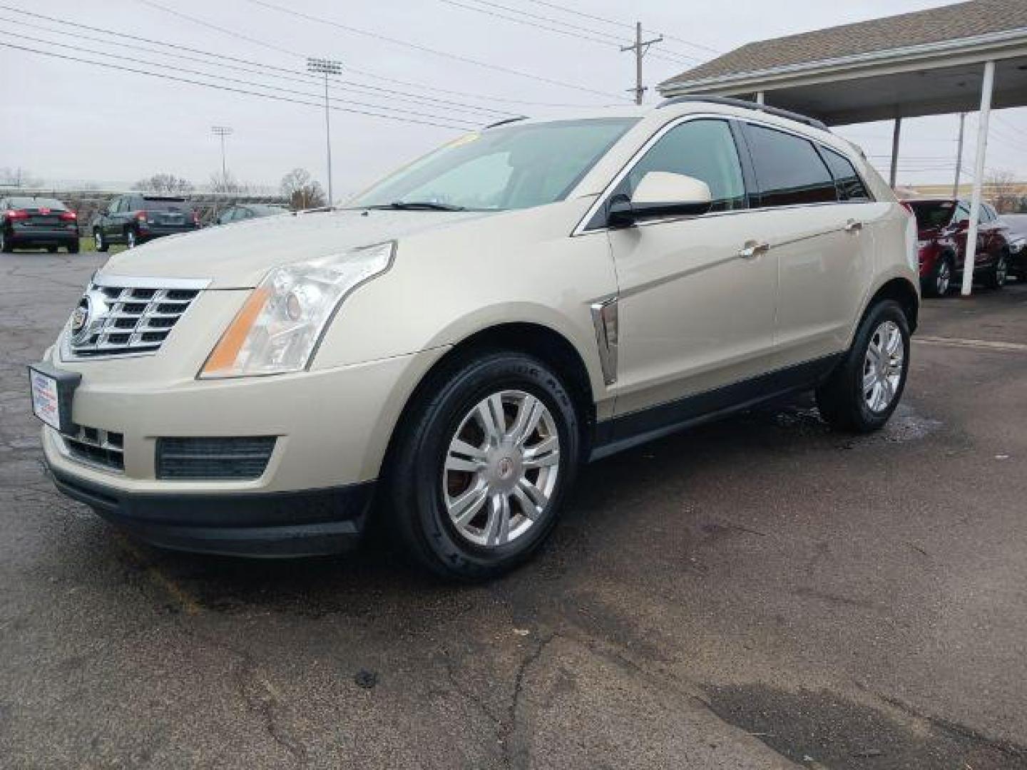 2014 Terra Mocha Metallic Cadillac SRX Standard FWD (3GYFNAE3XES) with an 3.6L V6 DOHC 24V FFV engine, 6-Speed Automatic transmission, located at 401 Woodman Dr, Riverside, OH, 45431, (937) 908-9800, 39.763779, -84.122063 - Photo#2