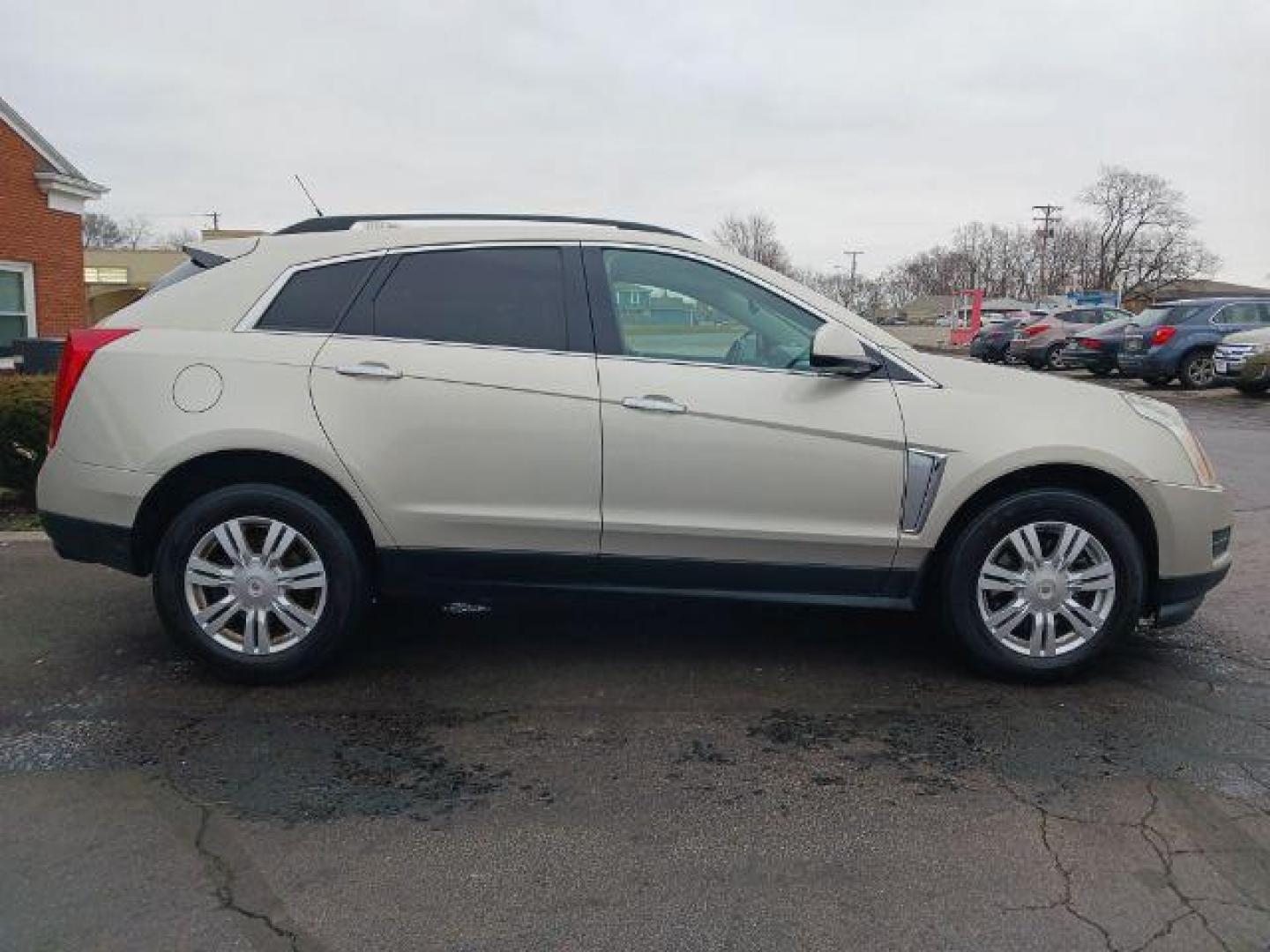 2014 Terra Mocha Metallic Cadillac SRX Standard FWD (3GYFNAE3XES) with an 3.6L V6 DOHC 24V FFV engine, 6-Speed Automatic transmission, located at 401 Woodman Dr, Riverside, OH, 45431, (937) 908-9800, 39.763779, -84.122063 - Photo#4