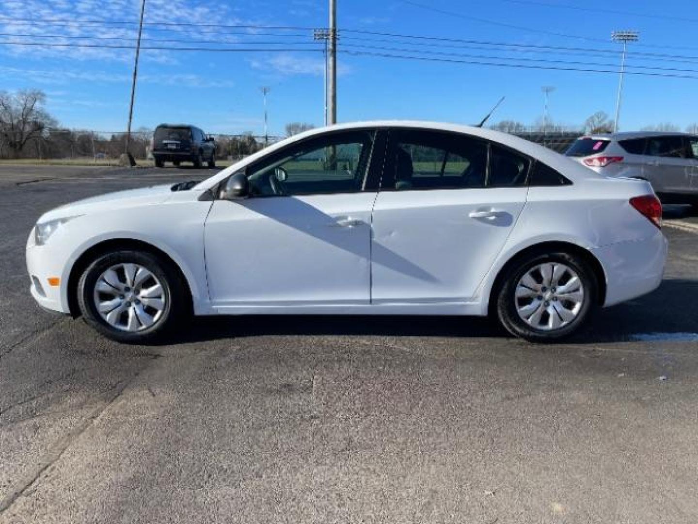 2014 Summit White Chevrolet Cruze LS Auto (1G1PA5SG7E7) with an 1.8L L4 DOHC 16V engine, 6-Speed Automatic transmission, located at 1184 Kauffman Ave, Fairborn, OH, 45324, (937) 908-9800, 39.807365, -84.029114 - Photo#2