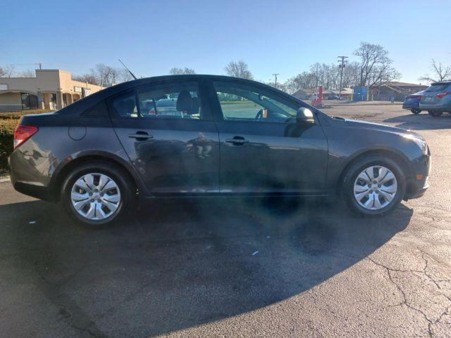 2014 Tungsten Metallic Chevrolet Cruze LS Auto (1G1PA5SH9E7) with an 1.8L L4 DOHC 16V FFV engine, 6-Speed Automatic transmission, located at 880 E. National Road, Vandalia, OH, 45377, (937) 908-9800, 39.892189, -84.181015 - Photo#4