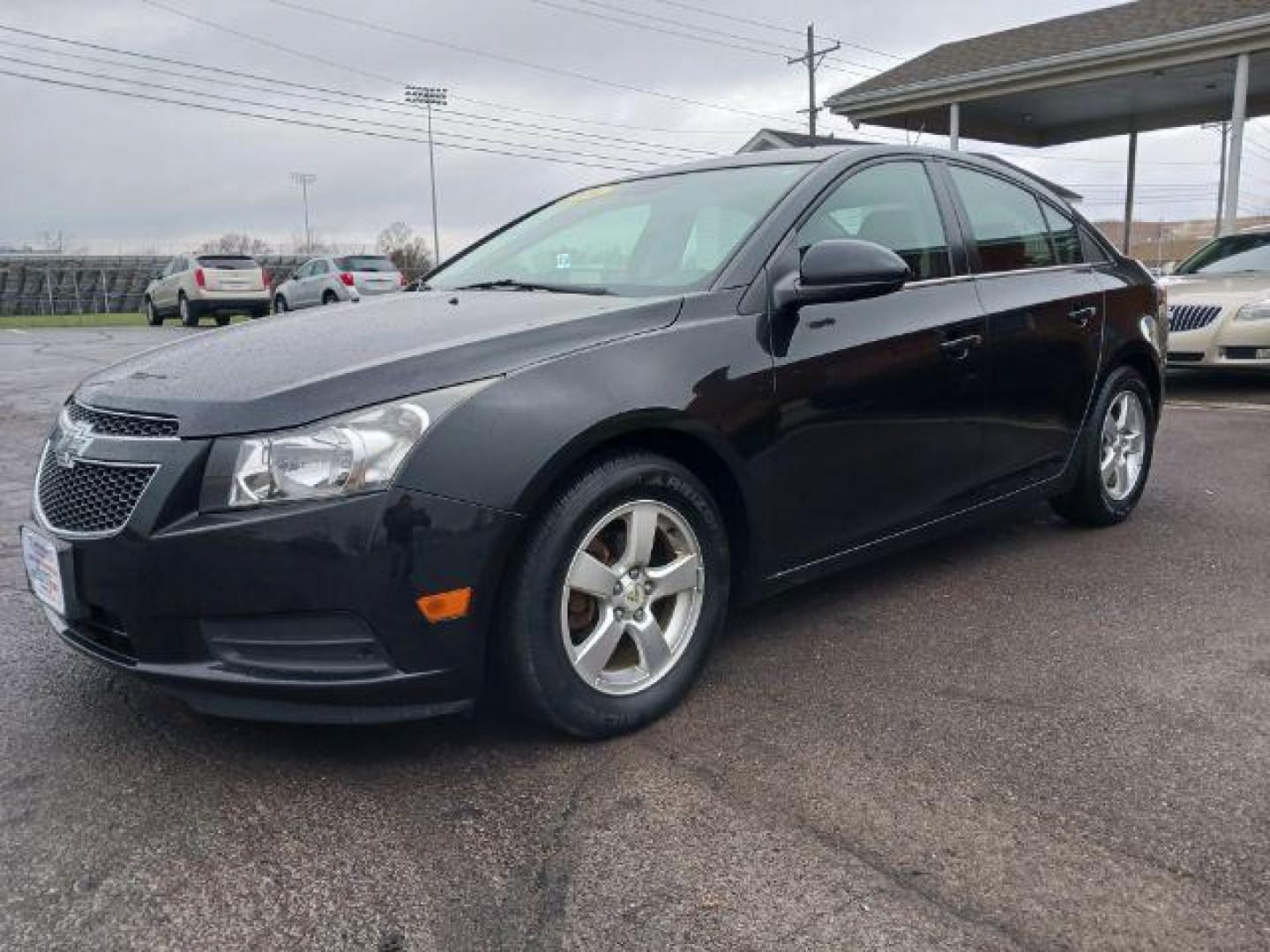 2014 Black Granite Metallic Chevrolet Cruze 1LT Auto (1G1PC5SB4E7) with an 1.4L L4 DOHC 16V TURBO engine, 6-Speed Automatic transmission, located at 880 E. National Road, Vandalia, OH, 45377, (937) 908-9800, 39.892189, -84.181015 - Photo#2