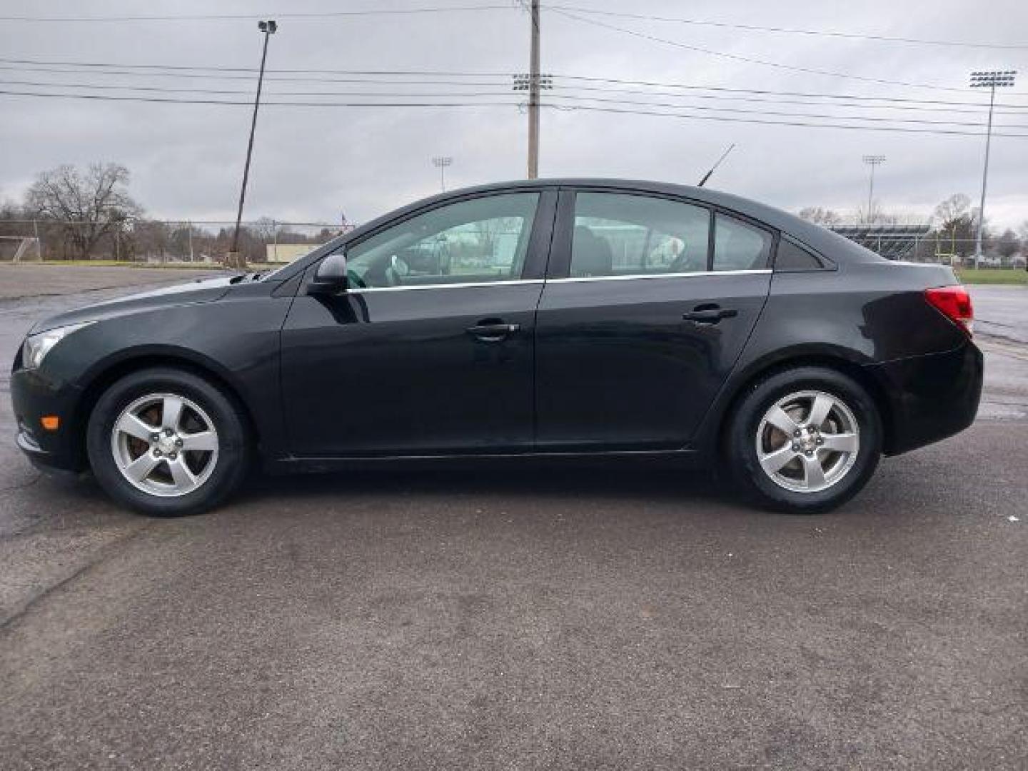 2014 Black Granite Metallic Chevrolet Cruze 1LT Auto (1G1PC5SB4E7) with an 1.4L L4 DOHC 16V TURBO engine, 6-Speed Automatic transmission, located at 880 E. National Road, Vandalia, OH, 45377, (937) 908-9800, 39.892189, -84.181015 - Photo#3