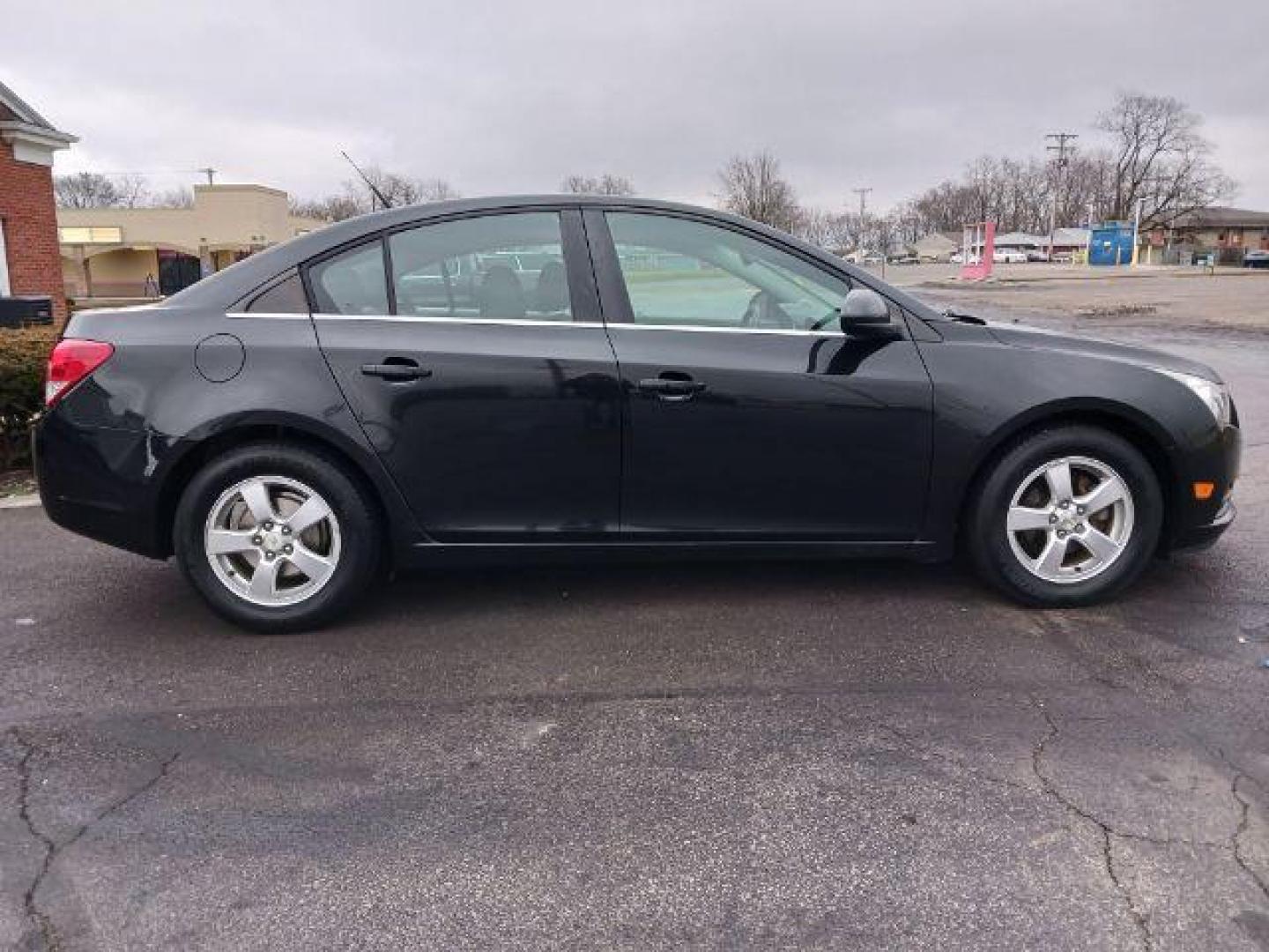 2014 Black Granite Metallic Chevrolet Cruze 1LT Auto (1G1PC5SB4E7) with an 1.4L L4 DOHC 16V TURBO engine, 6-Speed Automatic transmission, located at 880 E. National Road, Vandalia, OH, 45377, (937) 908-9800, 39.892189, -84.181015 - Photo#4