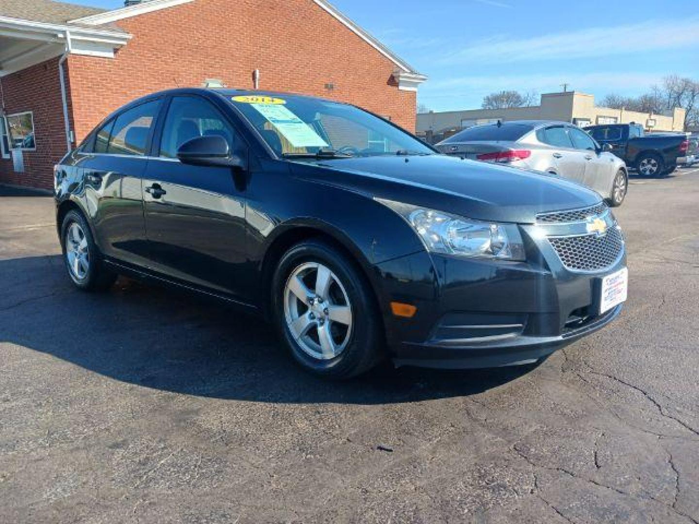 2014 Black Granite Metallic Chevrolet Cruze 1LT Auto (1G1PC5SB2E7) with an 1.4L L4 DOHC 16V TURBO engine, 6-Speed Automatic transmission, located at 880 E. National Road, Vandalia, OH, 45377, (937) 908-9800, 39.892189, -84.181015 - Photo#0