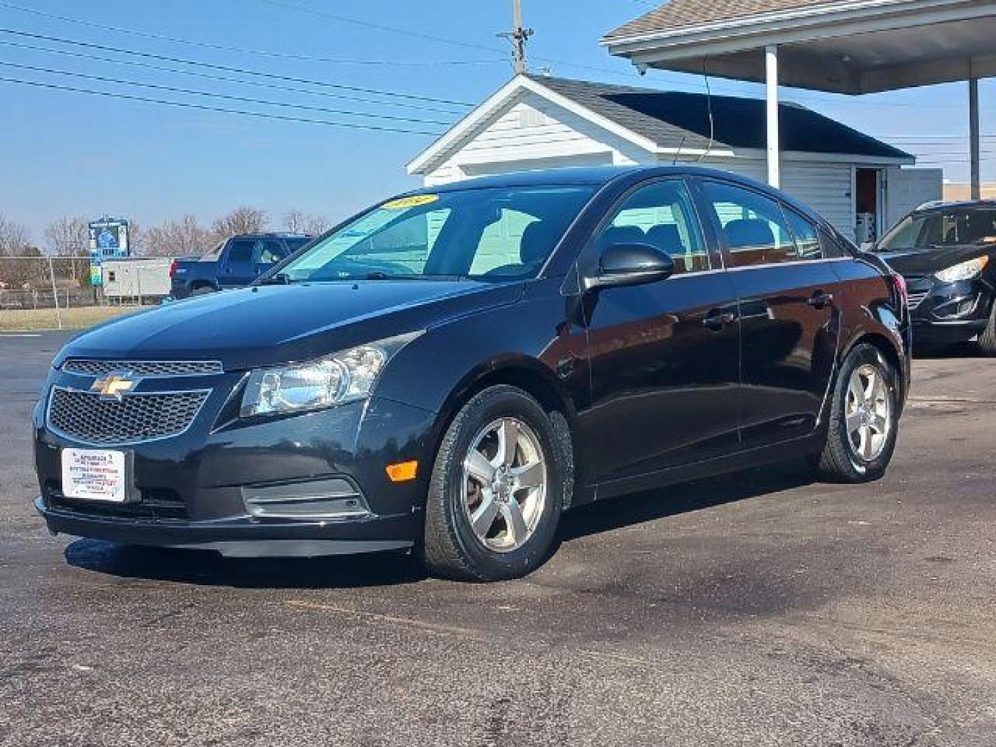 2014 Black Granite Metallic Chevrolet Cruze 1LT Auto (1G1PC5SB2E7) with an 1.4L L4 DOHC 16V TURBO engine, 6-Speed Automatic transmission, located at 880 E. National Road, Vandalia, OH, 45377, (937) 908-9800, 39.892189, -84.181015 - Photo#2