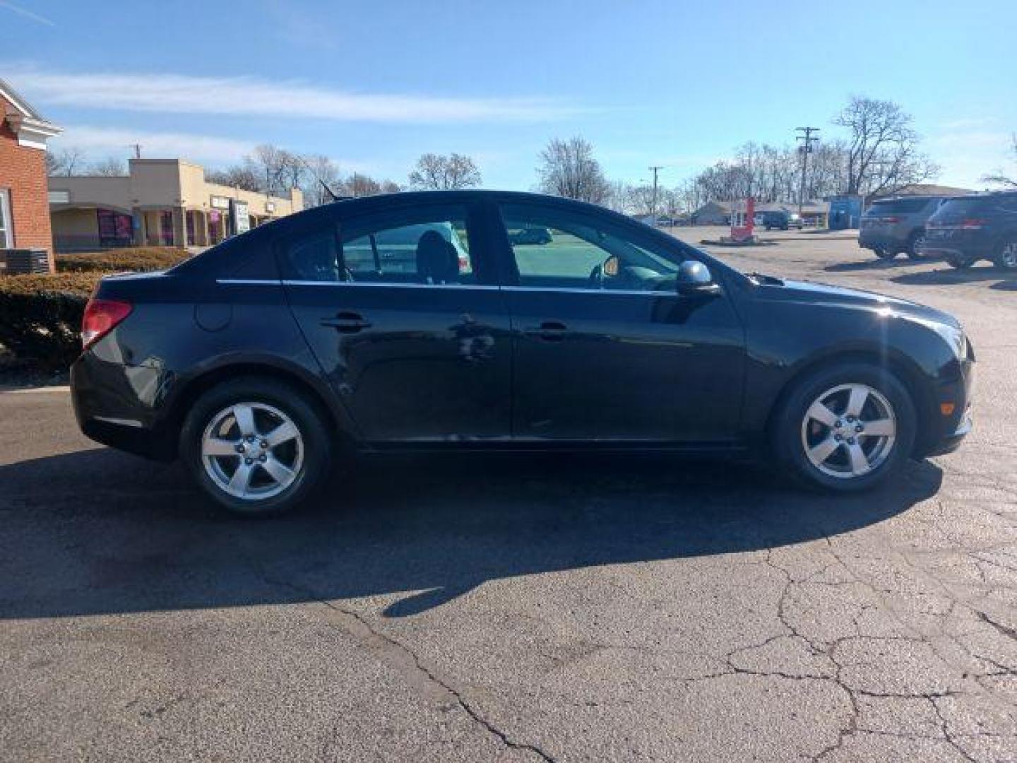 2014 Black Granite Metallic Chevrolet Cruze 1LT Auto (1G1PC5SB2E7) with an 1.4L L4 DOHC 16V TURBO engine, 6-Speed Automatic transmission, located at 880 E. National Road, Vandalia, OH, 45377, (937) 908-9800, 39.892189, -84.181015 - Photo#4