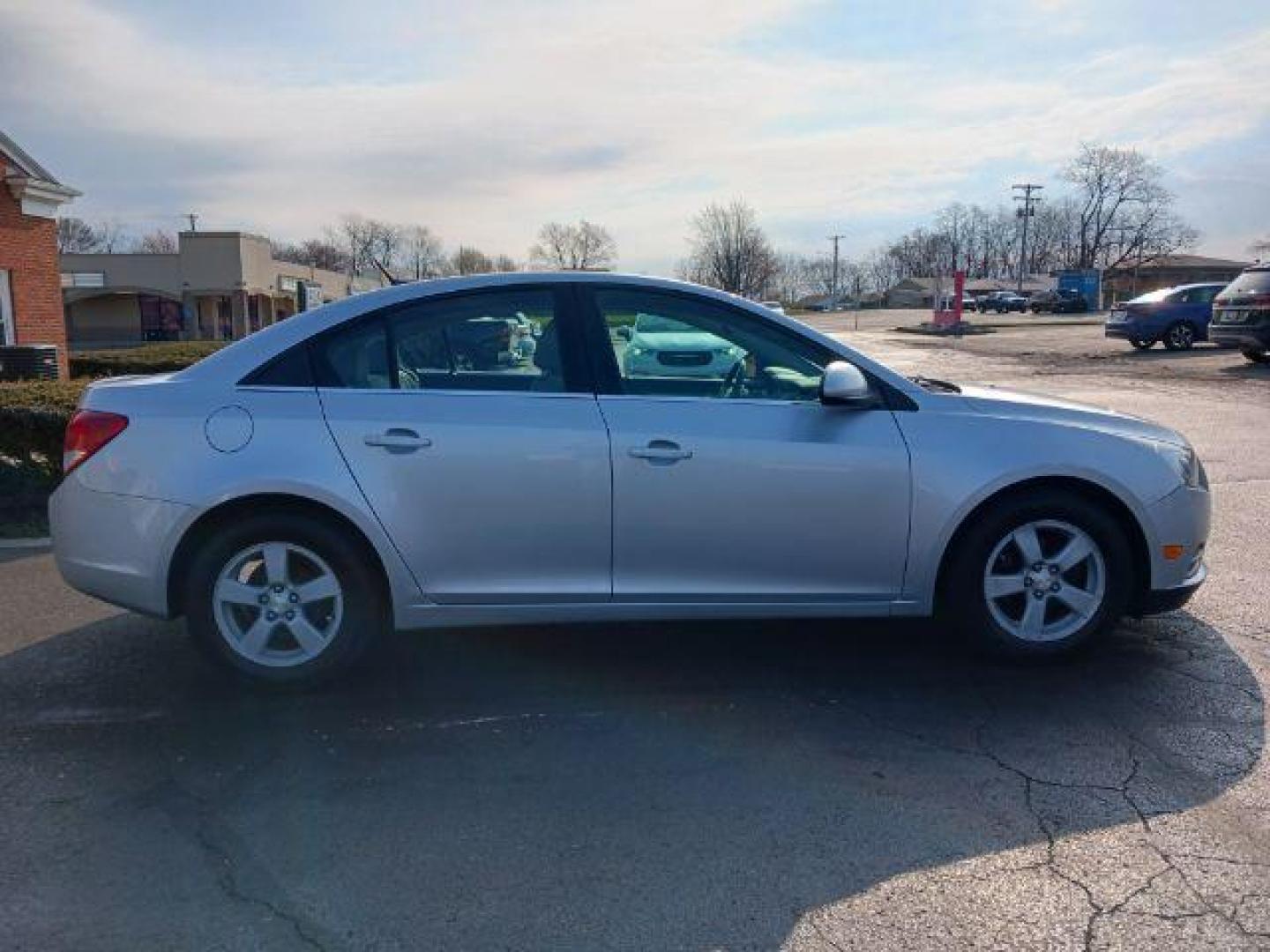 2014 Silver Ice Metallic Chevrolet Cruze 1LT Auto (1G1PC5SB0E7) with an 1.4L L4 DOHC 16V TURBO engine, 6-Speed Automatic transmission, located at 401 Woodman Dr, Riverside, OH, 45431, (937) 908-9800, 39.763779, -84.122063 - Photo#4