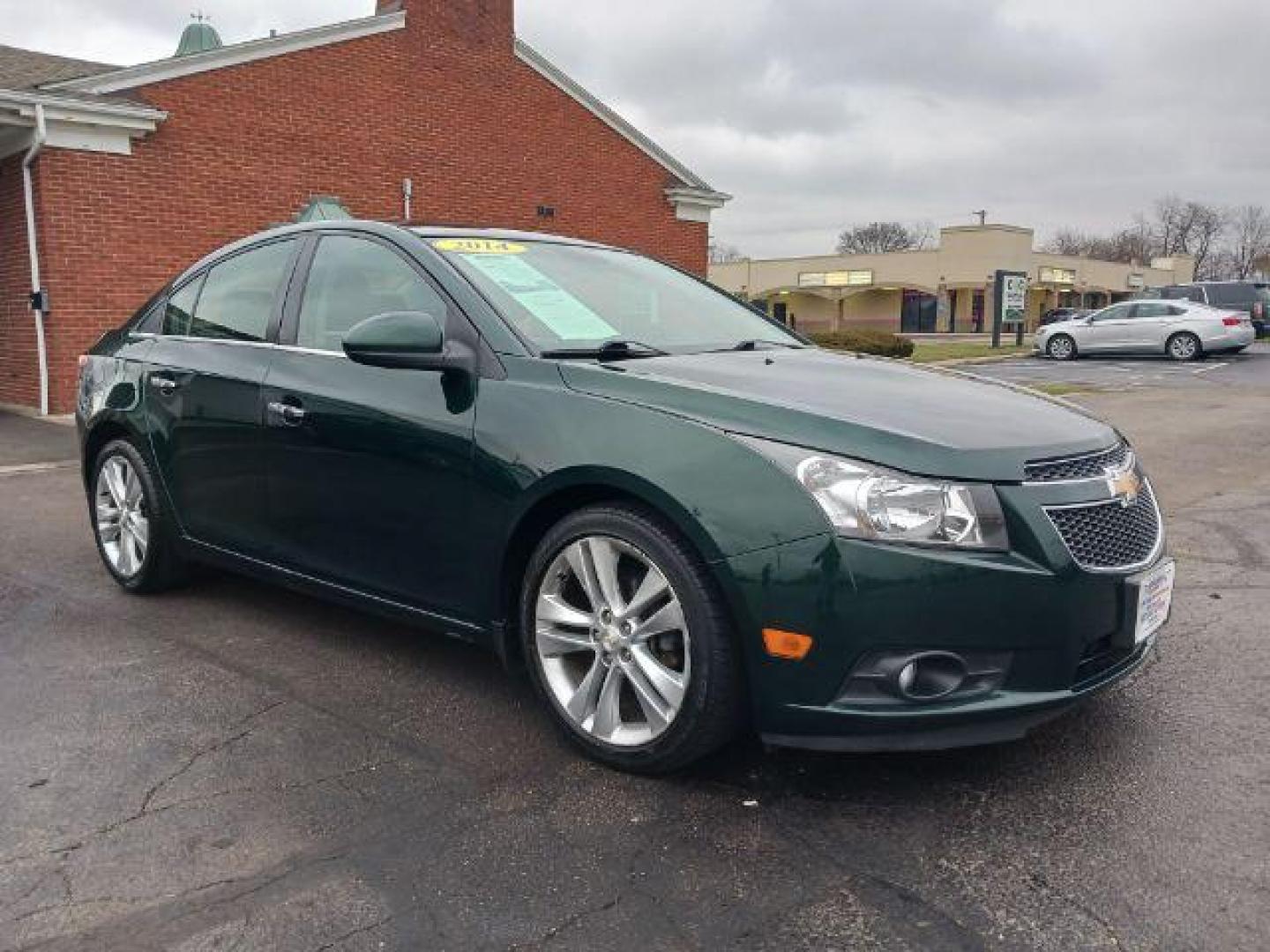 2014 Rainforest Green Metallic Chevrolet Cruze LTZ Auto (1G1PG5SB9E7) with an 1.4L L4 DOHC 16V TURBO engine, 6-Speed Automatic transmission, located at 1184 Kauffman Ave, Fairborn, OH, 45324, (937) 908-9800, 39.807365, -84.029114 - Photo#0