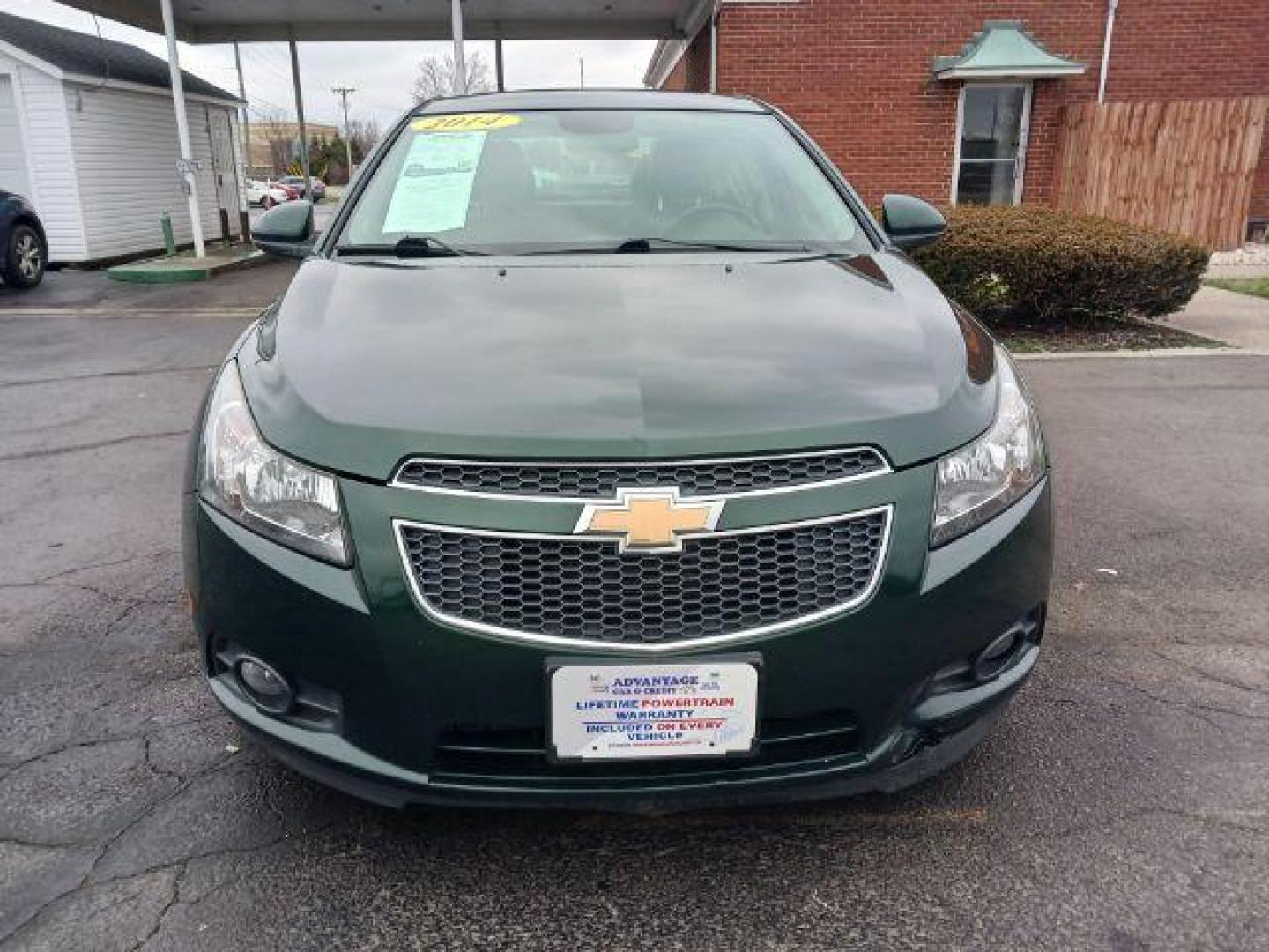 2014 Rainforest Green Metallic Chevrolet Cruze LTZ Auto (1G1PG5SB9E7) with an 1.4L L4 DOHC 16V TURBO engine, 6-Speed Automatic transmission, located at 1184 Kauffman Ave, Fairborn, OH, 45324, (937) 908-9800, 39.807365, -84.029114 - Photo#1