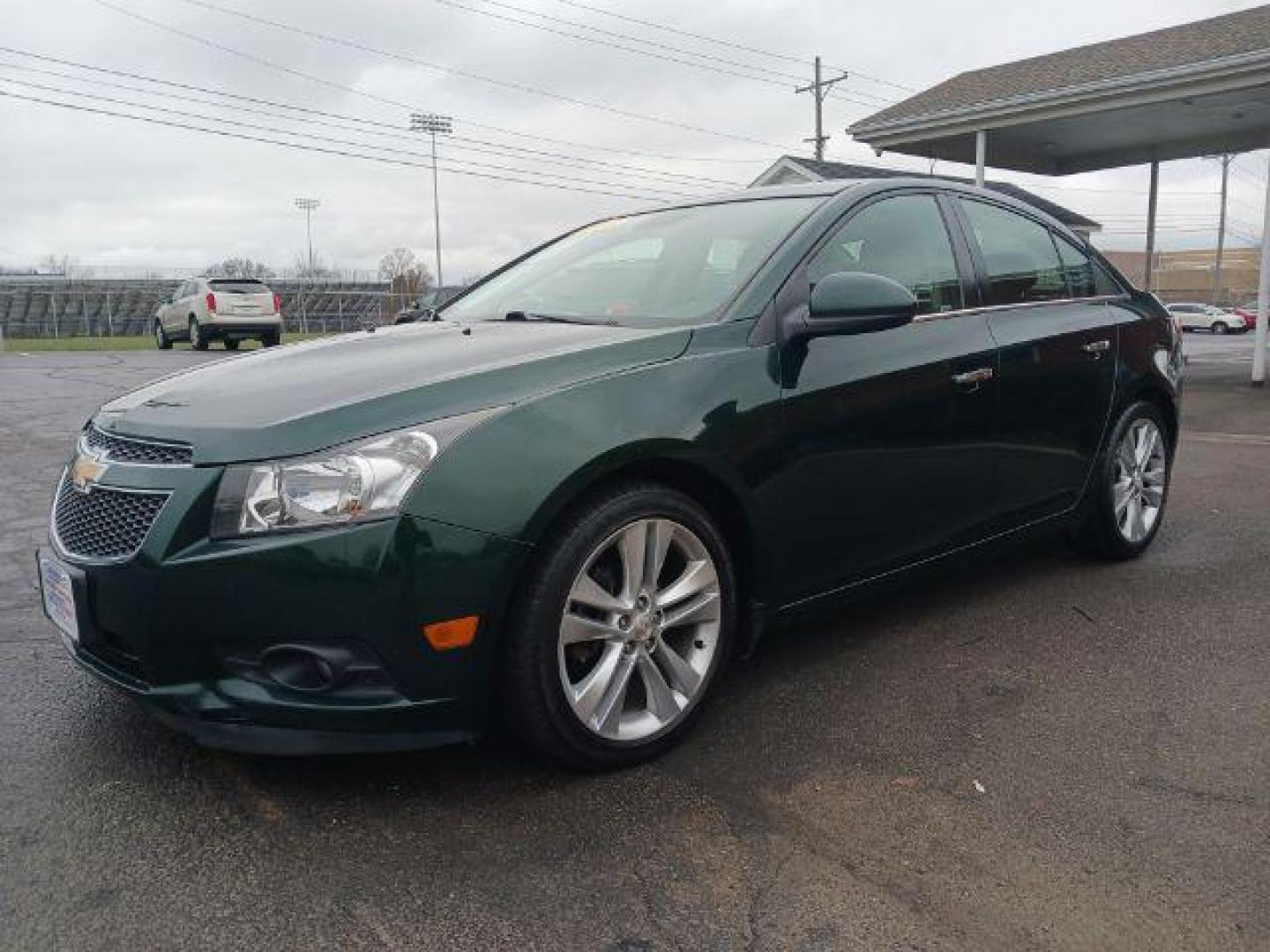 2014 Rainforest Green Metallic Chevrolet Cruze LTZ Auto (1G1PG5SB9E7) with an 1.4L L4 DOHC 16V TURBO engine, 6-Speed Automatic transmission, located at 1184 Kauffman Ave, Fairborn, OH, 45324, (937) 908-9800, 39.807365, -84.029114 - Photo#2