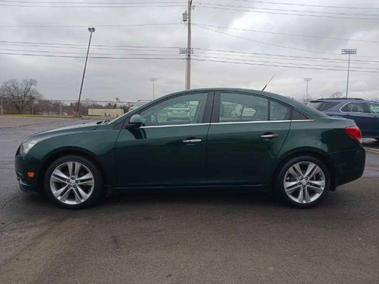 2014 Rainforest Green Metallic Chevrolet Cruze LTZ Auto (1G1PG5SB9E7) with an 1.4L L4 DOHC 16V TURBO engine, 6-Speed Automatic transmission, located at 1184 Kauffman Ave, Fairborn, OH, 45324, (937) 908-9800, 39.807365, -84.029114 - Photo#3