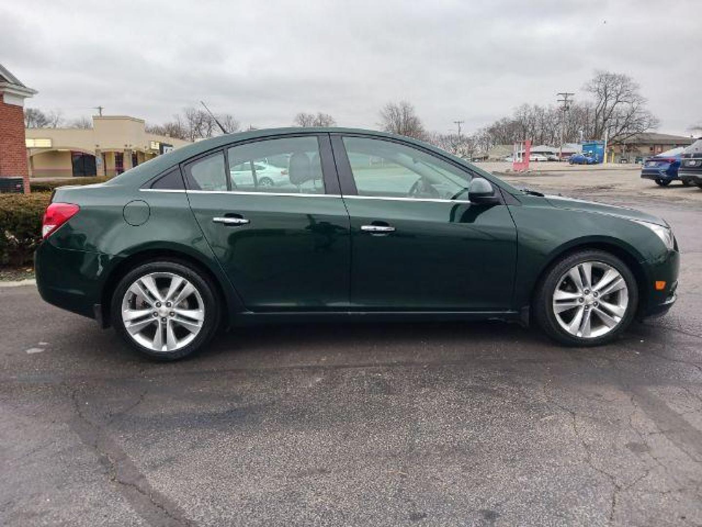 2014 Rainforest Green Metallic Chevrolet Cruze LTZ Auto (1G1PG5SB9E7) with an 1.4L L4 DOHC 16V TURBO engine, 6-Speed Automatic transmission, located at 1184 Kauffman Ave, Fairborn, OH, 45324, (937) 908-9800, 39.807365, -84.029114 - Photo#4