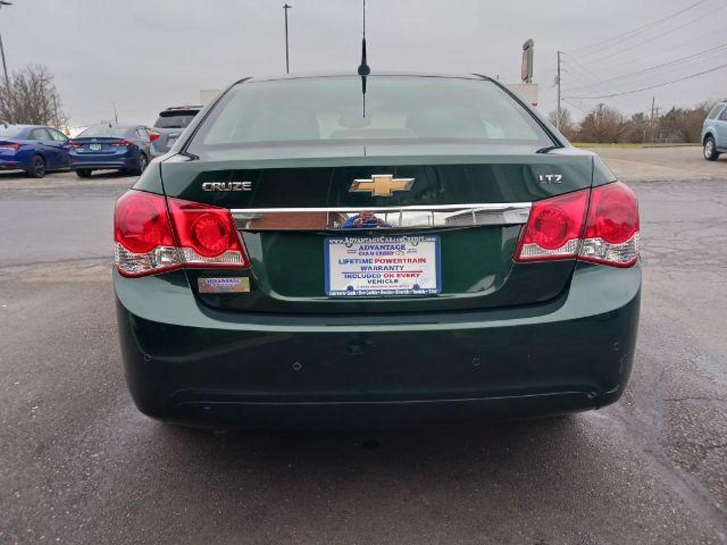 2014 Rainforest Green Metallic Chevrolet Cruze LTZ Auto (1G1PG5SB9E7) with an 1.4L L4 DOHC 16V TURBO engine, 6-Speed Automatic transmission, located at 1184 Kauffman Ave, Fairborn, OH, 45324, (937) 908-9800, 39.807365, -84.029114 - Photo#5