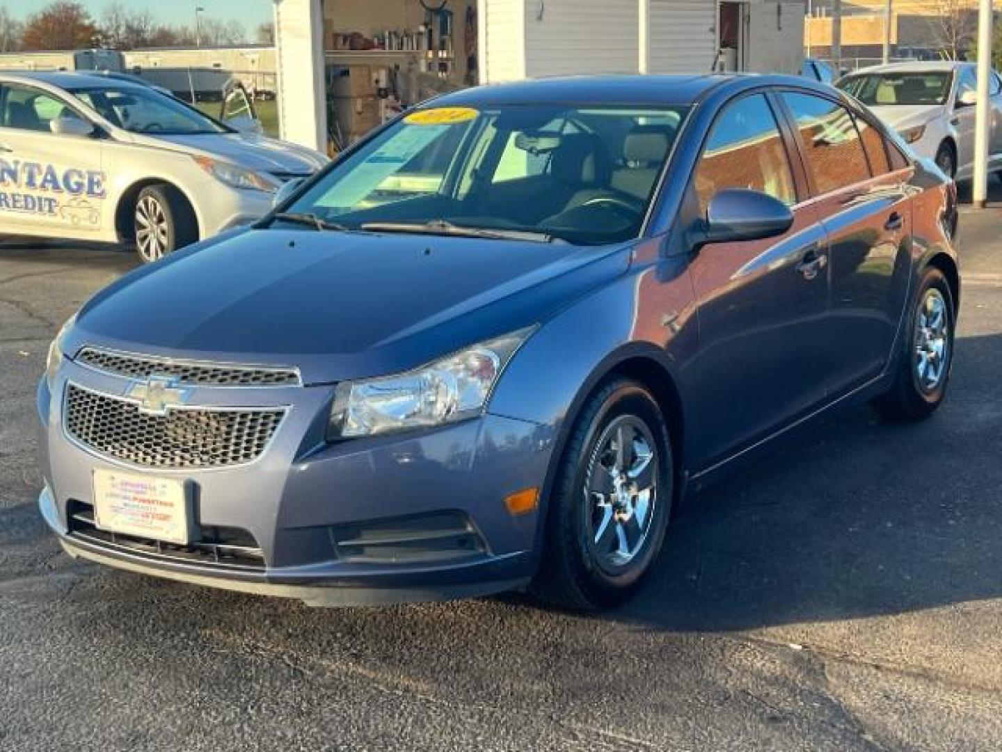 2014 Atlantis Blue Metallic Chevrolet Cruze 1LT Auto (1G1PC5SB8E7) with an 1.4L L4 DOHC 16V TURBO engine, 6-Speed Automatic transmission, located at 1230 East Main St, Xenia, OH, 45385, (937) 908-9800, 39.687321, -83.910294 - Photo#2