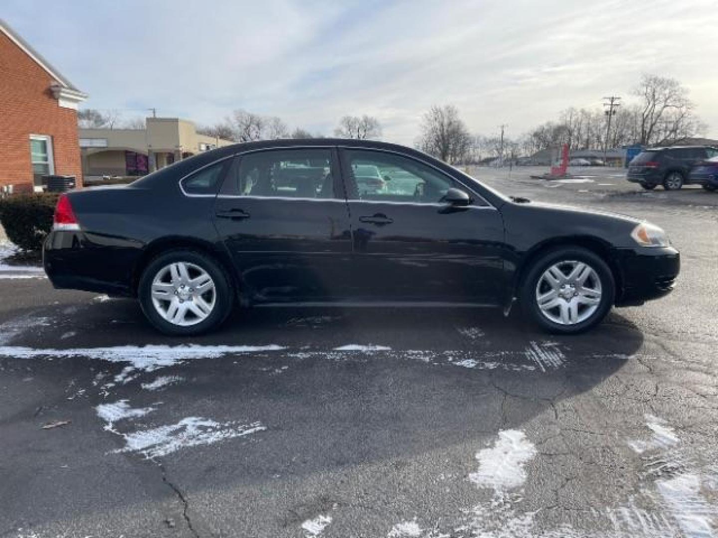 2014 Black Chevrolet Impala Limited LT (2G1WB5E37E1) with an 3.6L V6 DOHC 16V FFV engine, 6-Speed Automatic transmission, located at 1184 Kauffman Ave, Fairborn, OH, 45324, (937) 908-9800, 39.807365, -84.029114 - Photo#3