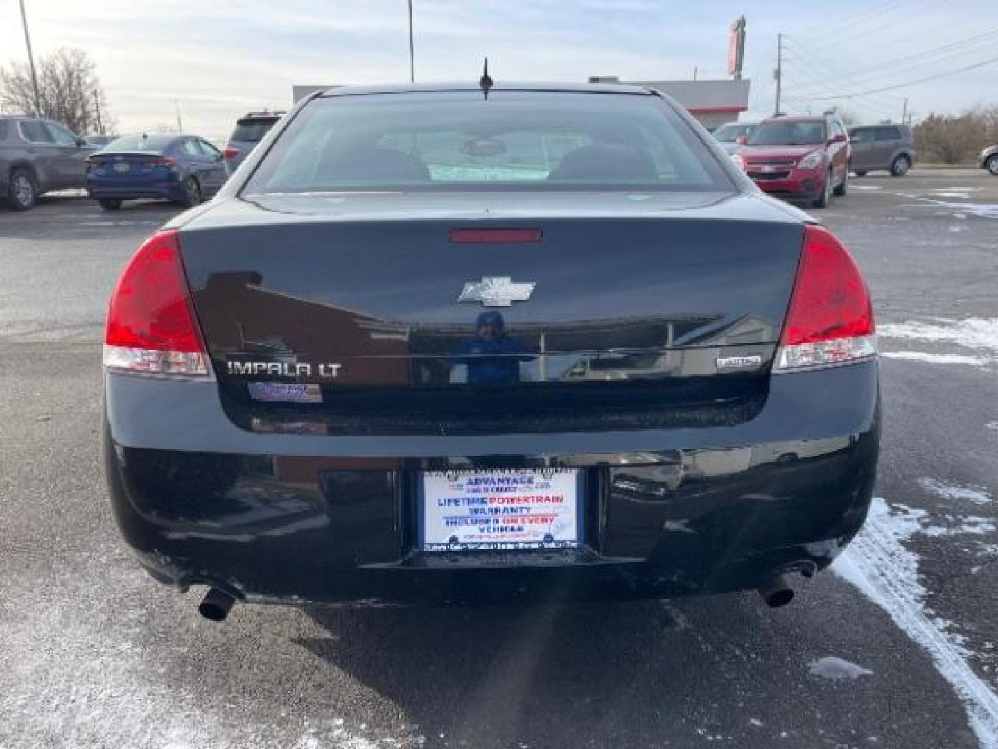 2014 Black Chevrolet Impala Limited LT (2G1WB5E37E1) with an 3.6L V6 DOHC 16V FFV engine, 6-Speed Automatic transmission, located at 1184 Kauffman Ave, Fairborn, OH, 45324, (937) 908-9800, 39.807365, -84.029114 - Photo#4