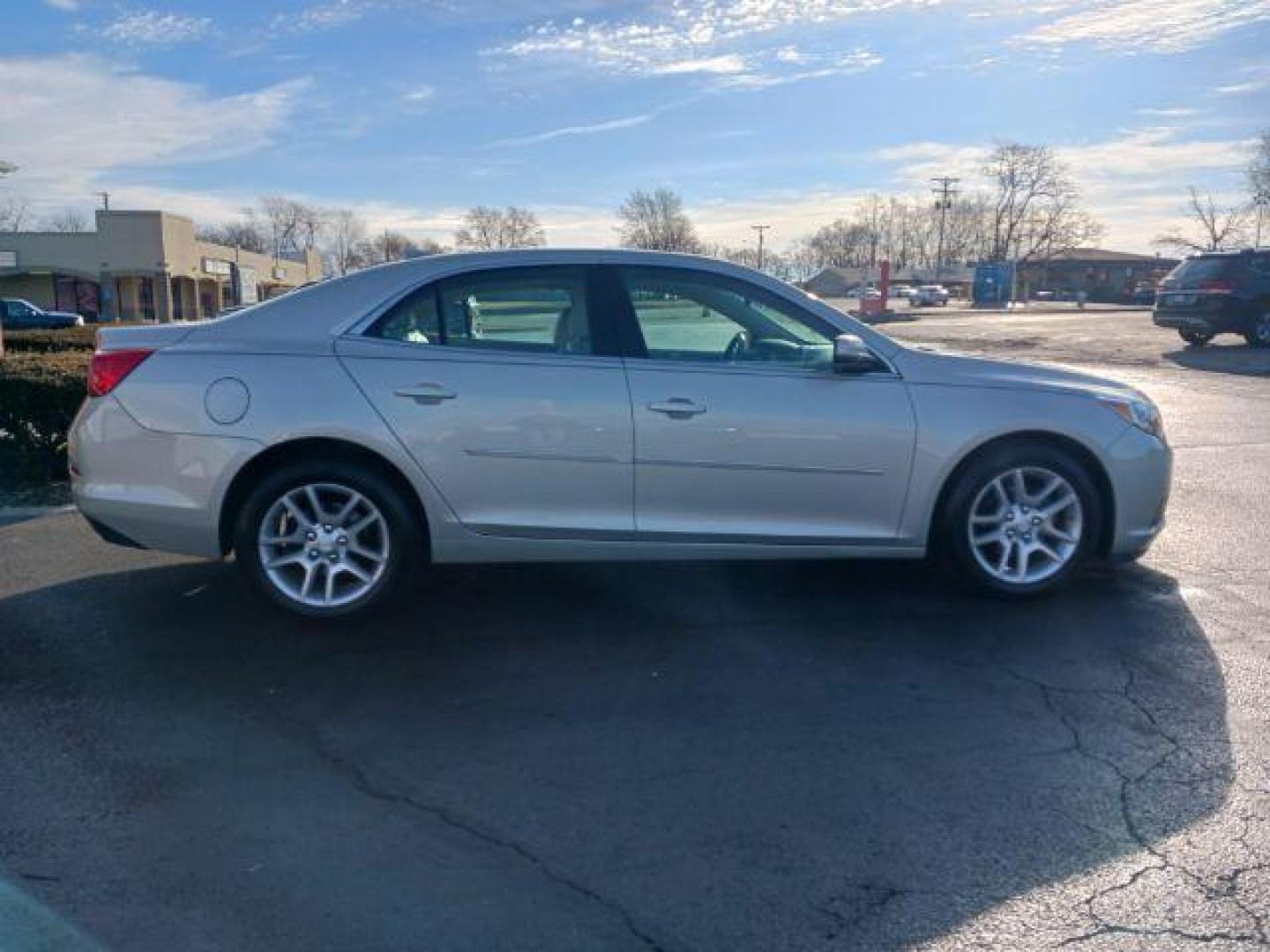 2014 Champagne Silver Metallic Chevrolet Malibu 1LT (1G11C5SL6EF) with an 2.5L L4 DOHC 16V engine, 6-Speed Automatic transmission, located at 880 E. National Road, Vandalia, OH, 45377, (937) 908-9800, 39.892189, -84.181015 - Photo#4