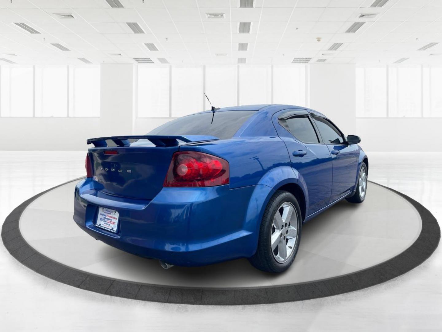 2014 Blue Streak Pearlcoat Dodge Avenger SE (1C3CDZAG1EN) with an 3.6L V6 DOHC 24V FFV engine, 6-Speed Automatic transmission, located at 1184 Kauffman Ave, Fairborn, OH, 45324, (937) 908-9800, 39.807365, -84.029114 - Photo#2