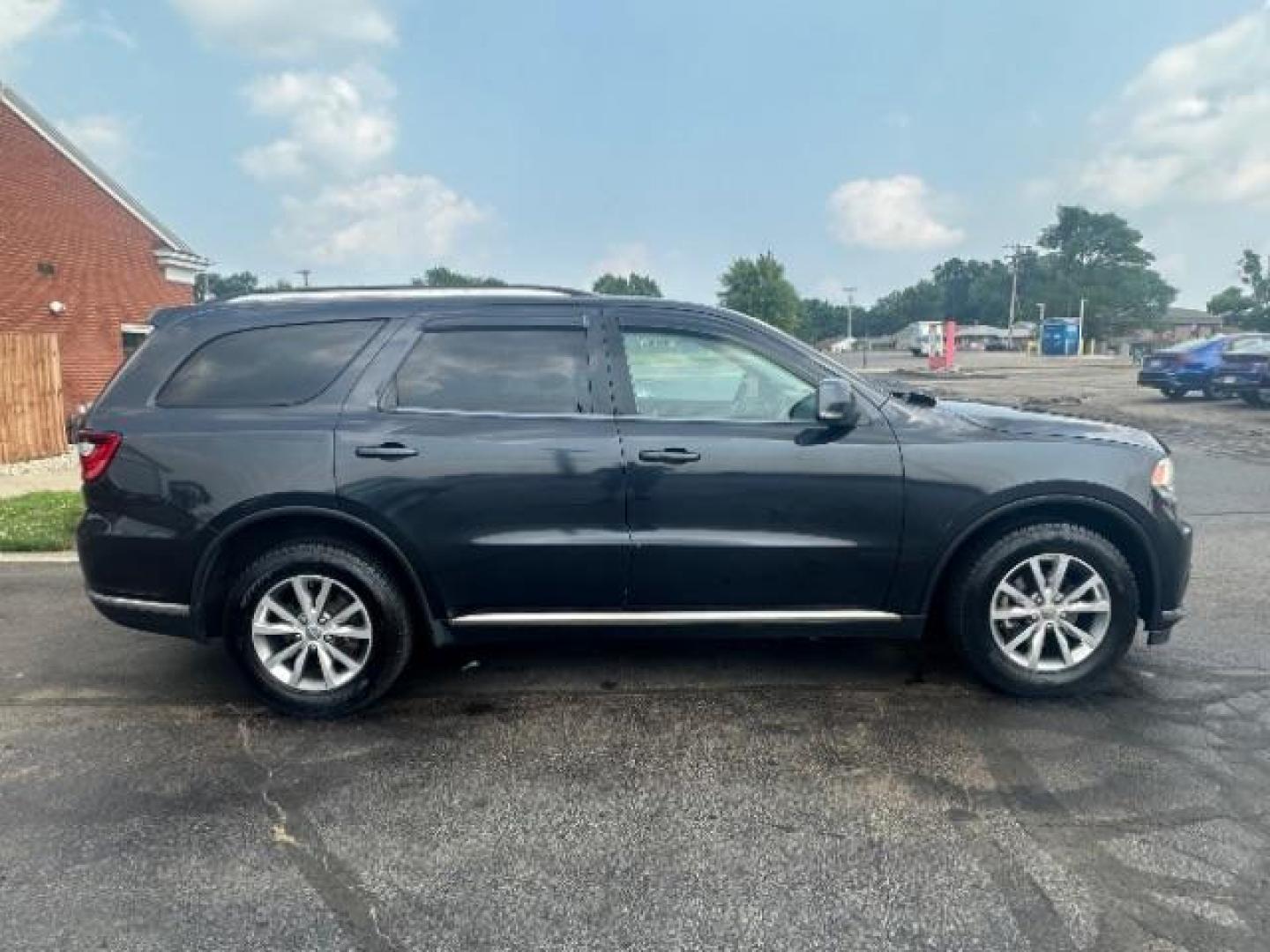 2014 Granite Crystal Met CC Dodge Durango Limited AWD (1C4RDJDG3EC) with an 3.6L V6 DOHC 24V engine, 8-Speed Automatic transmission, located at 1184 Kauffman Ave, Fairborn, OH, 45324, (937) 908-9800, 39.807365, -84.029114 - Third Row - Photo#5