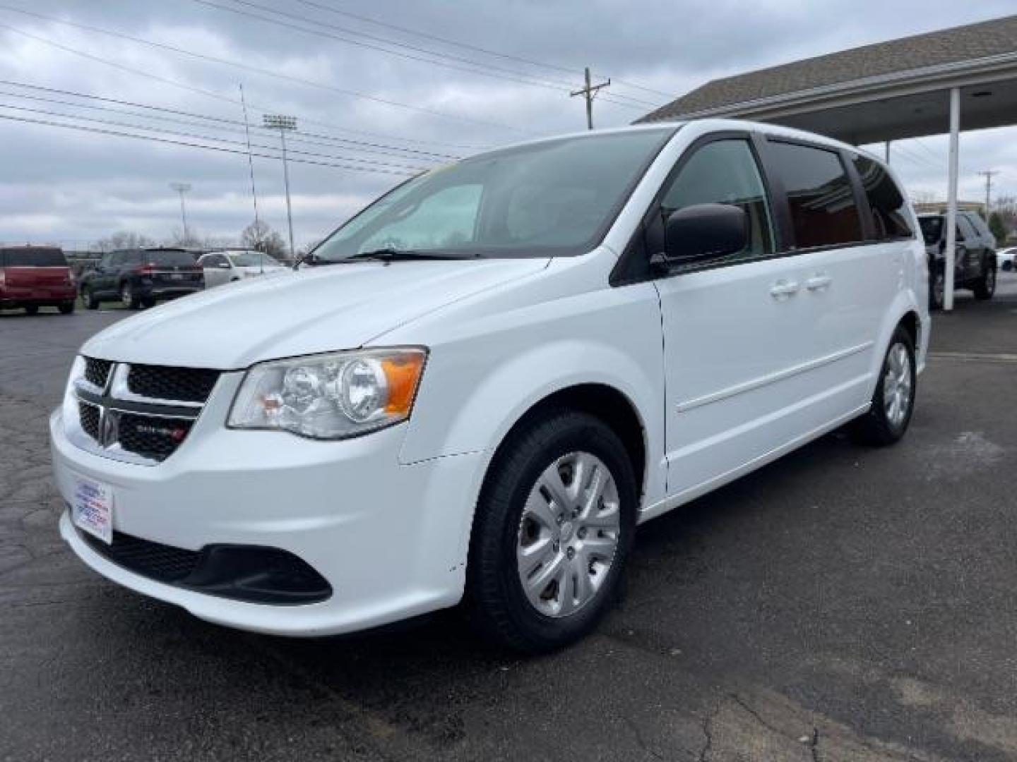 2014 Bright White Clearcoat Dodge Grand Caravan SE (2C4RDGBG9ER) with an 3.6L V6 DOHC 24V engine, 6-Speed Automatic transmission, located at 880 E. National Road, Vandalia, OH, 45377, (937) 908-9800, 39.892189, -84.181015 - Photo#1