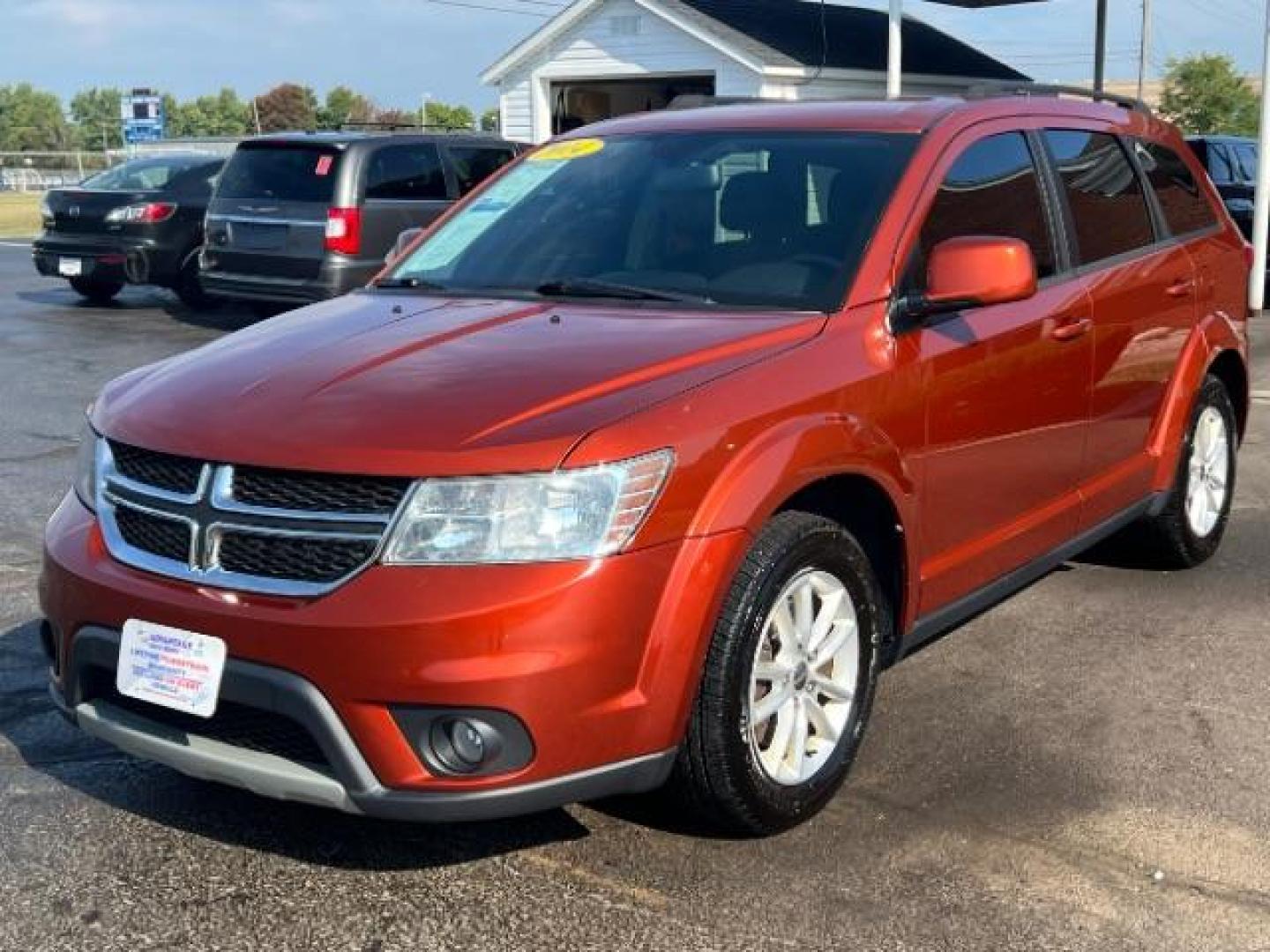 2014 Copperhead Pearlcoat Dodge Journey SXT (3C4PDCBB5ET) with an 2.4L L6 DOHC 16V engine, 4-Speed Automatic transmission, located at 1184 Kauffman Ave, Fairborn, OH, 45324, (937) 908-9800, 39.807365, -84.029114 - Photo#2