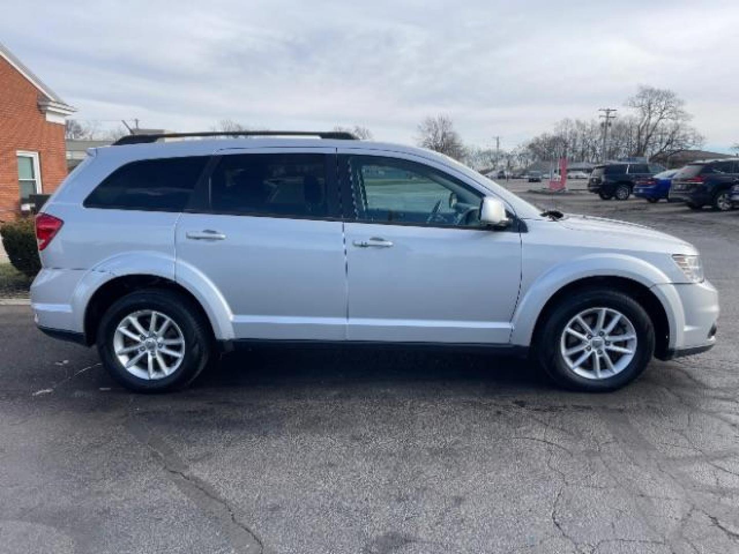 2014 Bright Silver Metallic CC Dodge Journey SXT (3C4PDCBG0ET) with an 3.6L V6 DOHC 24V engine, 6-Speed Automatic transmission, located at 401 Woodman Dr, Riverside, OH, 45431, (937) 908-9800, 39.763779, -84.122063 - Photo#3