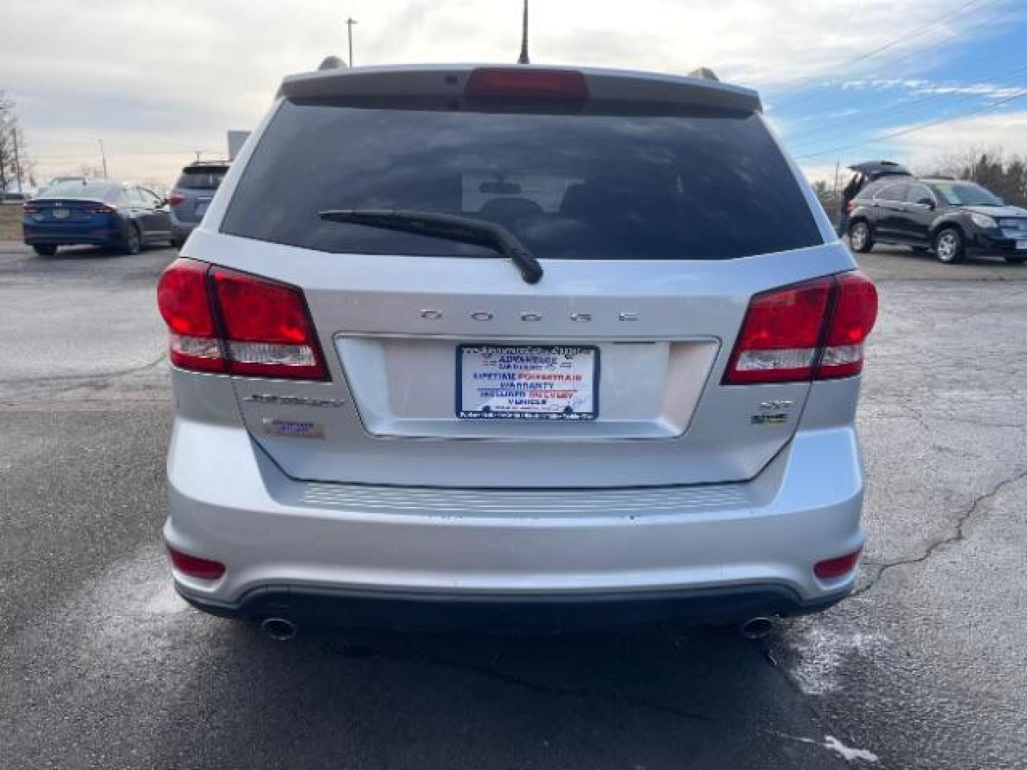 2014 Bright Silver Metallic CC Dodge Journey SXT (3C4PDCBG0ET) with an 3.6L V6 DOHC 24V engine, 6-Speed Automatic transmission, located at 401 Woodman Dr, Riverside, OH, 45431, (937) 908-9800, 39.763779, -84.122063 - Photo#4