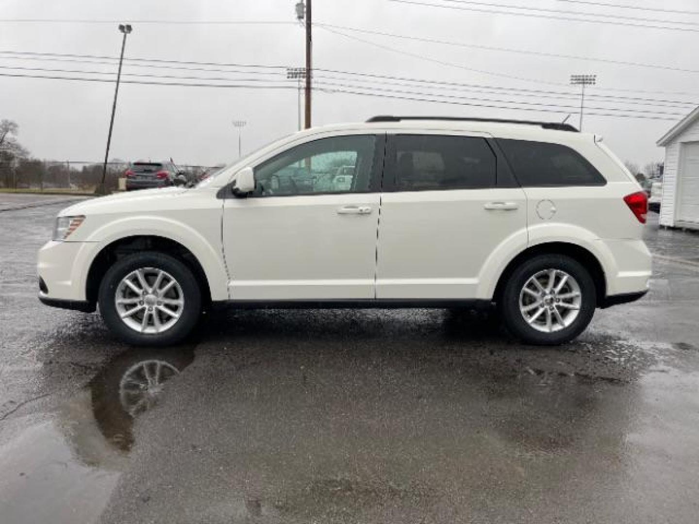 2014 Pearl White Tri-Coat Dodge Journey SXT (3C4PDCBG0ET) with an 3.6L V6 DOHC 24V engine, 6-Speed Automatic transmission, located at 880 E. National Road, Vandalia, OH, 45377, (937) 908-9800, 39.892189, -84.181015 - Photo#2