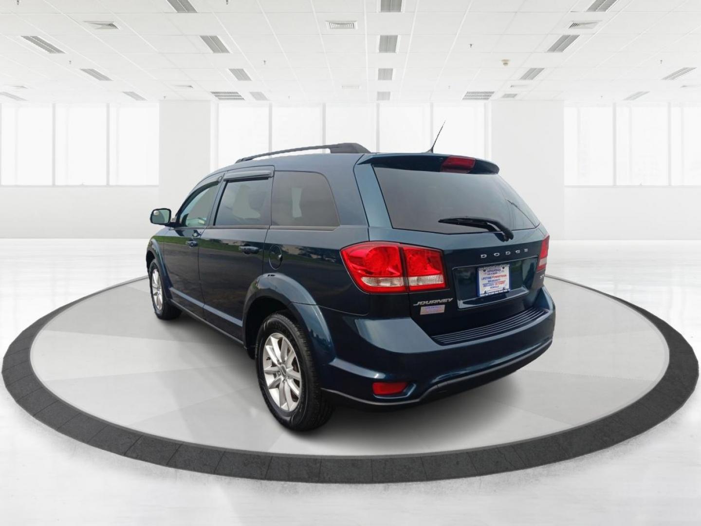 2014 Fathom Blue Pearlcoat Dodge Journey (3C4PDCBB1ET) with an 2.4L L6 DOHC 16V engine, 4-Speed Automatic transmission, located at 401 Woodman Dr, Riverside, OH, 45431, (937) 908-9800, 39.763779, -84.122063 - Photo#4