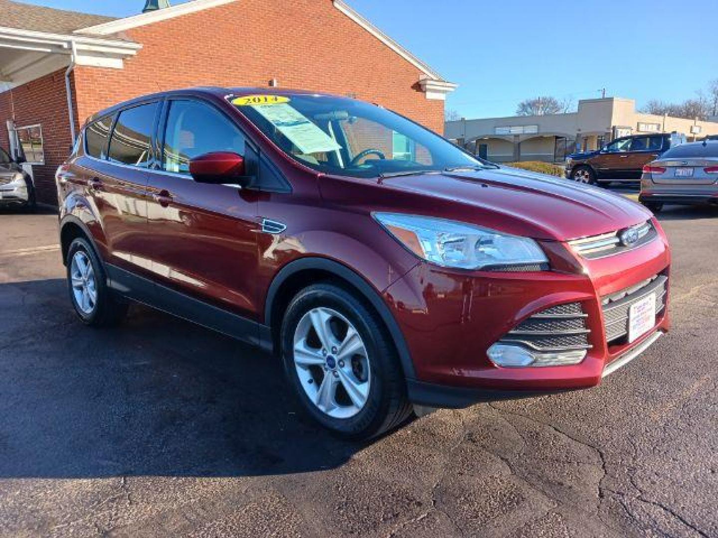 2014 Ruby Red Tinted CC Ford Escape SE FWD (1FMCU0G93EU) with an 2.0L L4 DOHC 16V engine, 6-Speed Automatic transmission, located at 401 Woodman Dr, Riverside, OH, 45431, (937) 908-9800, 39.763779, -84.122063 - Photo#0